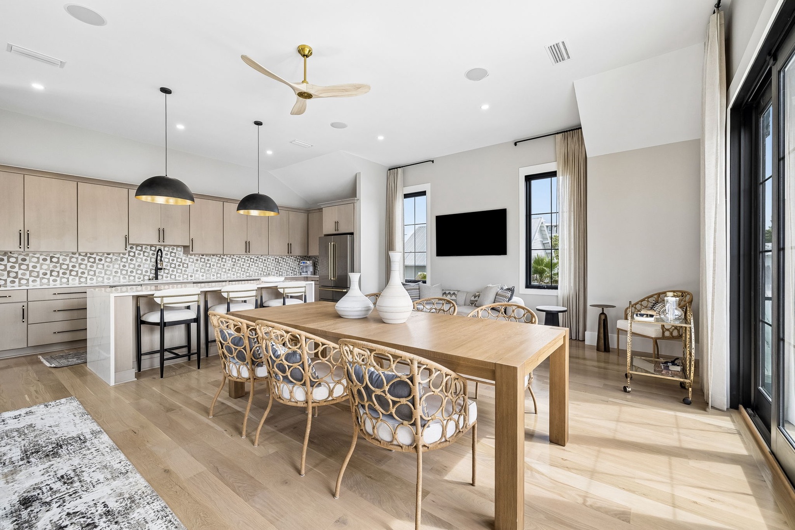 Picture yourself gathering around this beautiful table—light-filled, open, and designed for memorable meals. The modern kitchen invites you to cook together, while the cozy seating area beckons for evenings unwinding with loved ones.