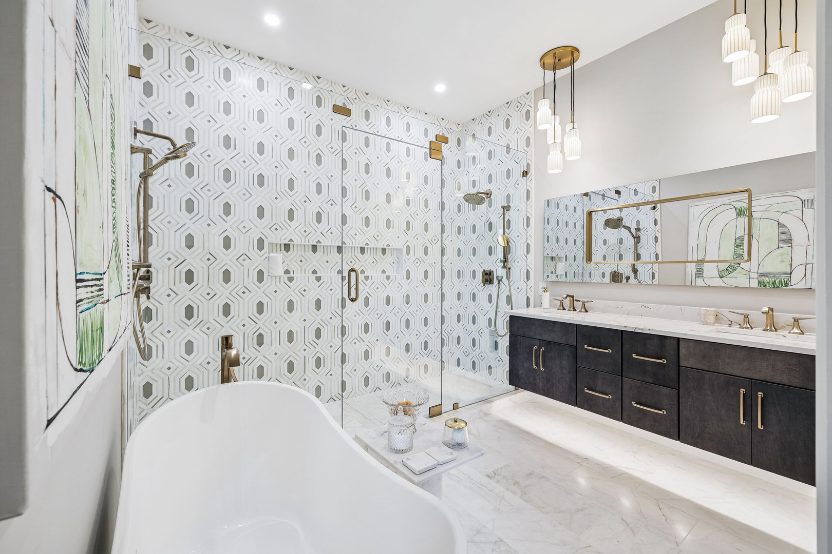 Unwind in your spa-like bathroom featuring a luxurious soaking tub, elegant geometric tile work, and gleaming gold fixtures that add a touch of modern sophistication.