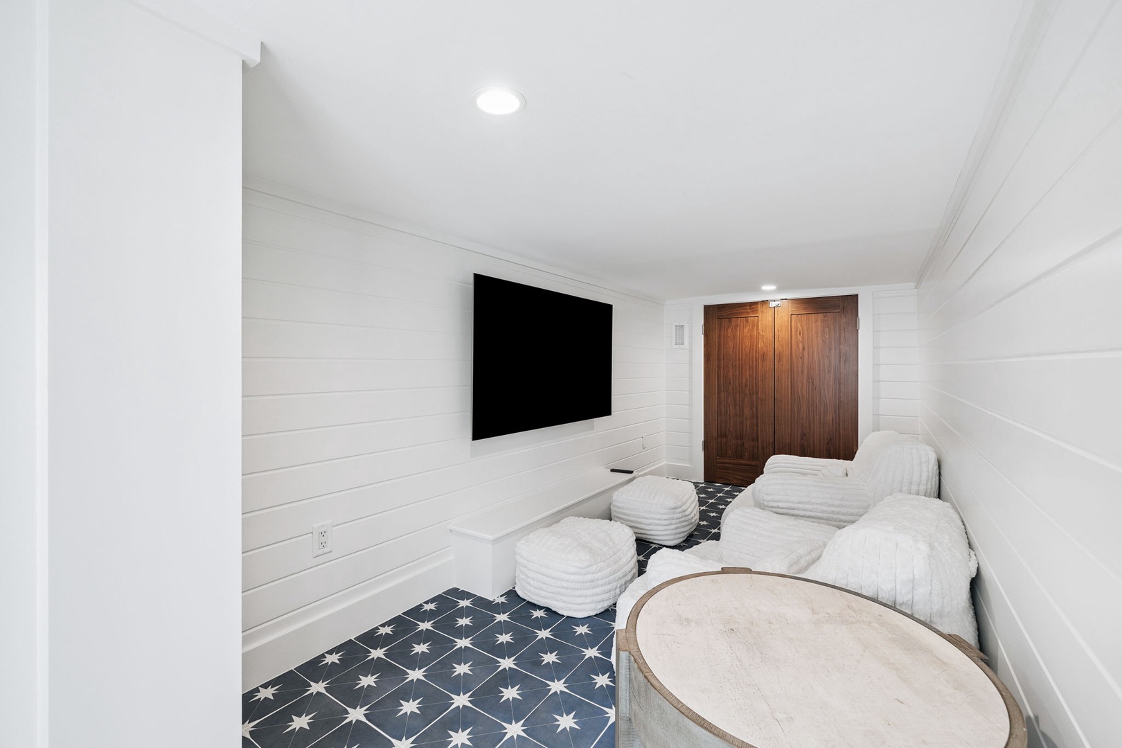 Sink into plush recliners in your private theater room, complete with a large screen for movie nights.