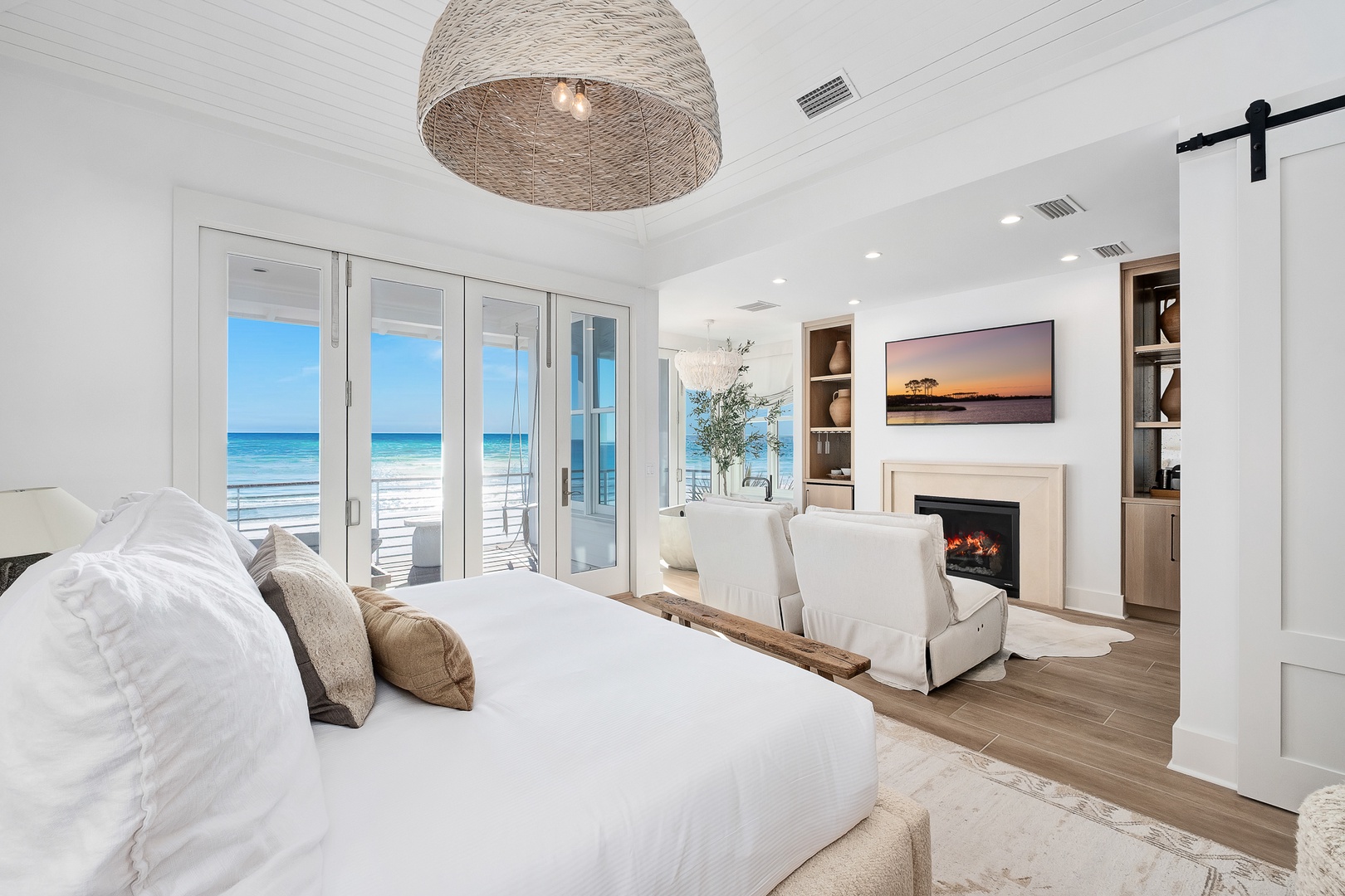 Wake up to stunning ocean views from your luxurious bedroom, complete with cozy fireplace and private beach access.