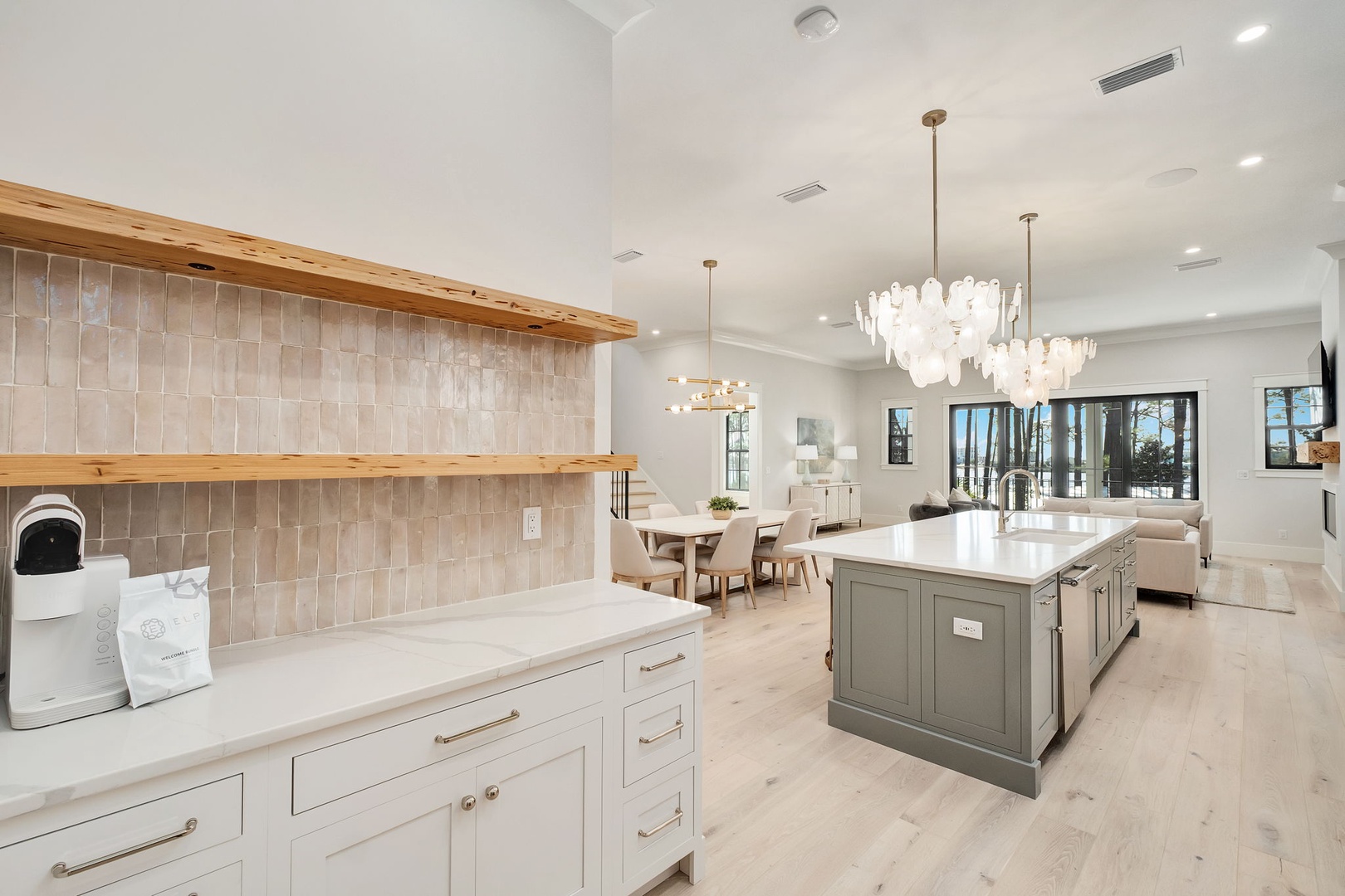 Your gourmet kitchen features stunning open shelving, designer fixtures, and a spacious island perfect for cooking memorable meals together.