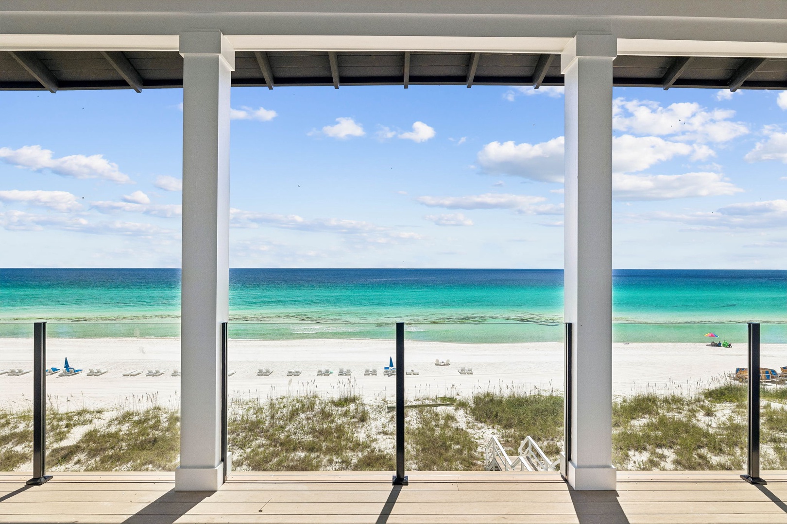 Step onto your private covered terrace and take in the stunning stretch of white sand and turquoise water. The beach is just steps away, inviting you to unwind with endless ocean views.