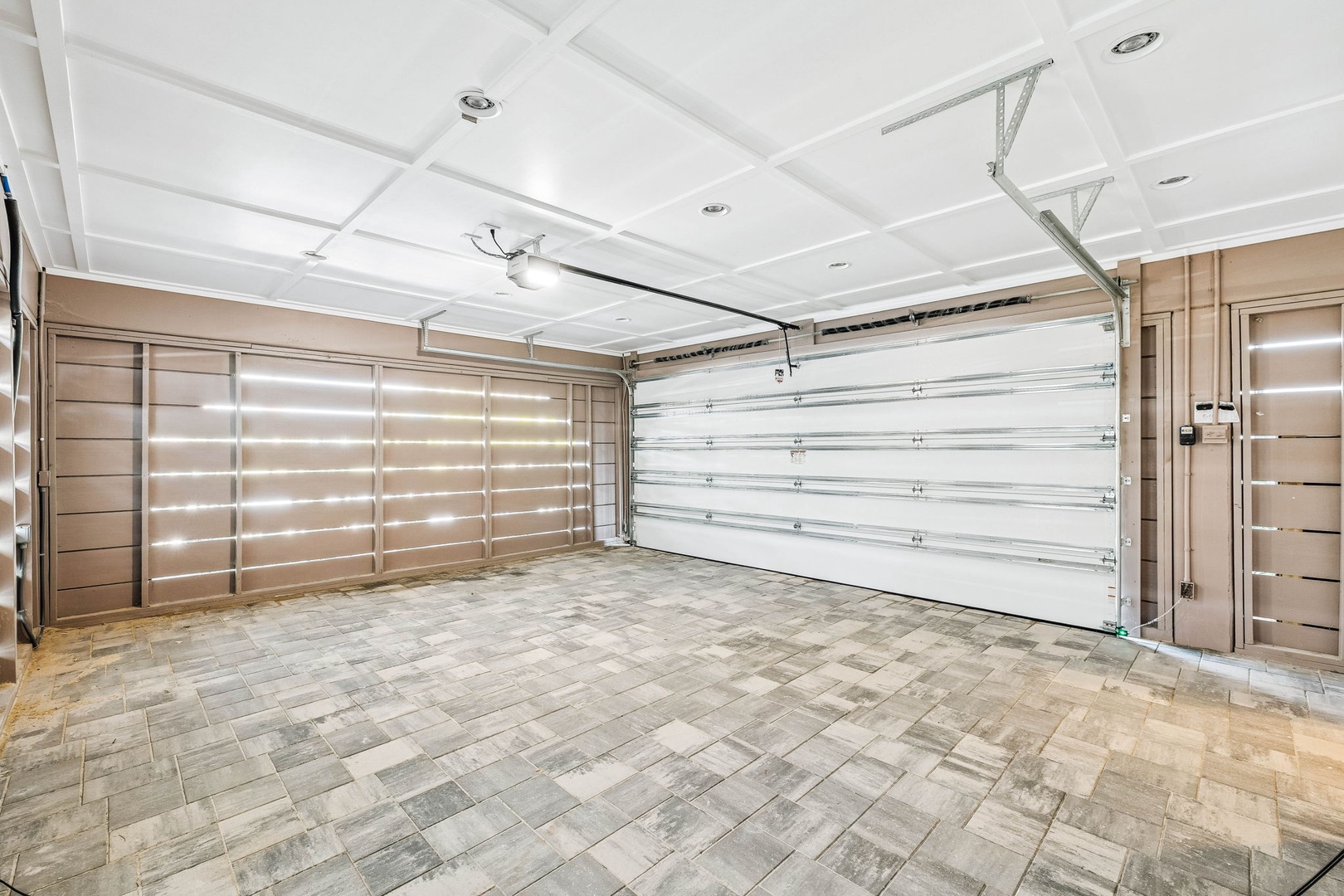 A spacious two-car garage with modern finishes and ample space for your vehicles and storage needs.