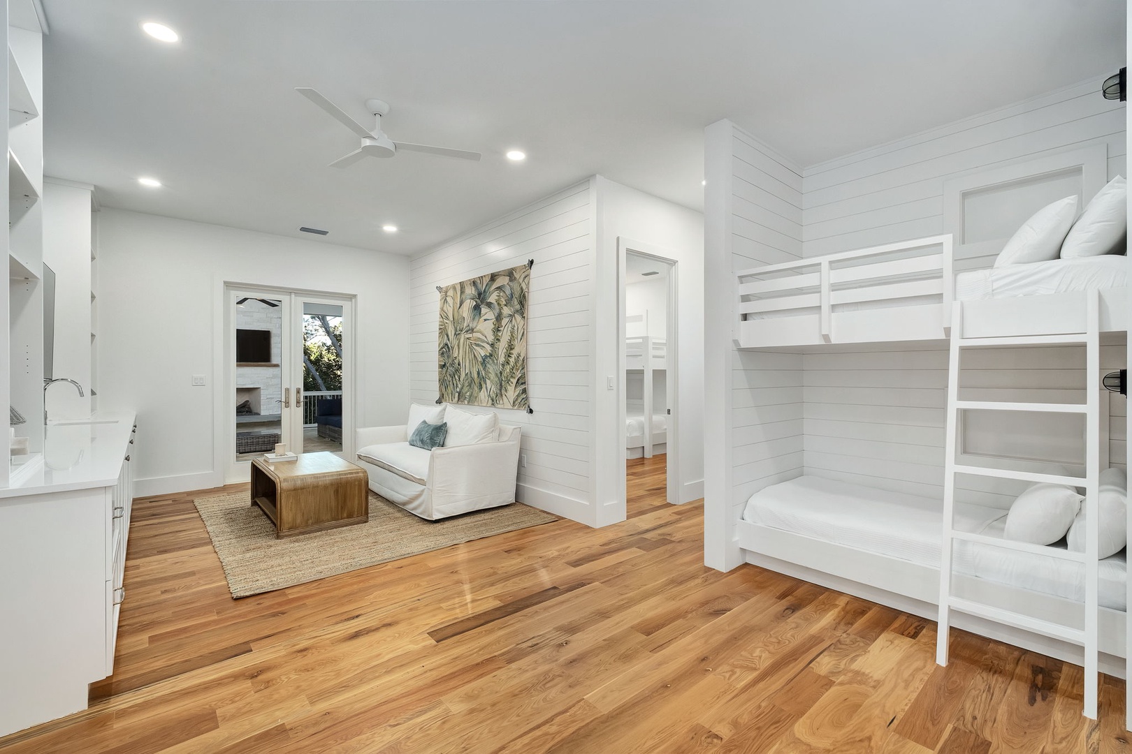 Relax in your bright, coastal-inspired space with built-in bunk beds and a cozy seating area—perfect for families or groups.