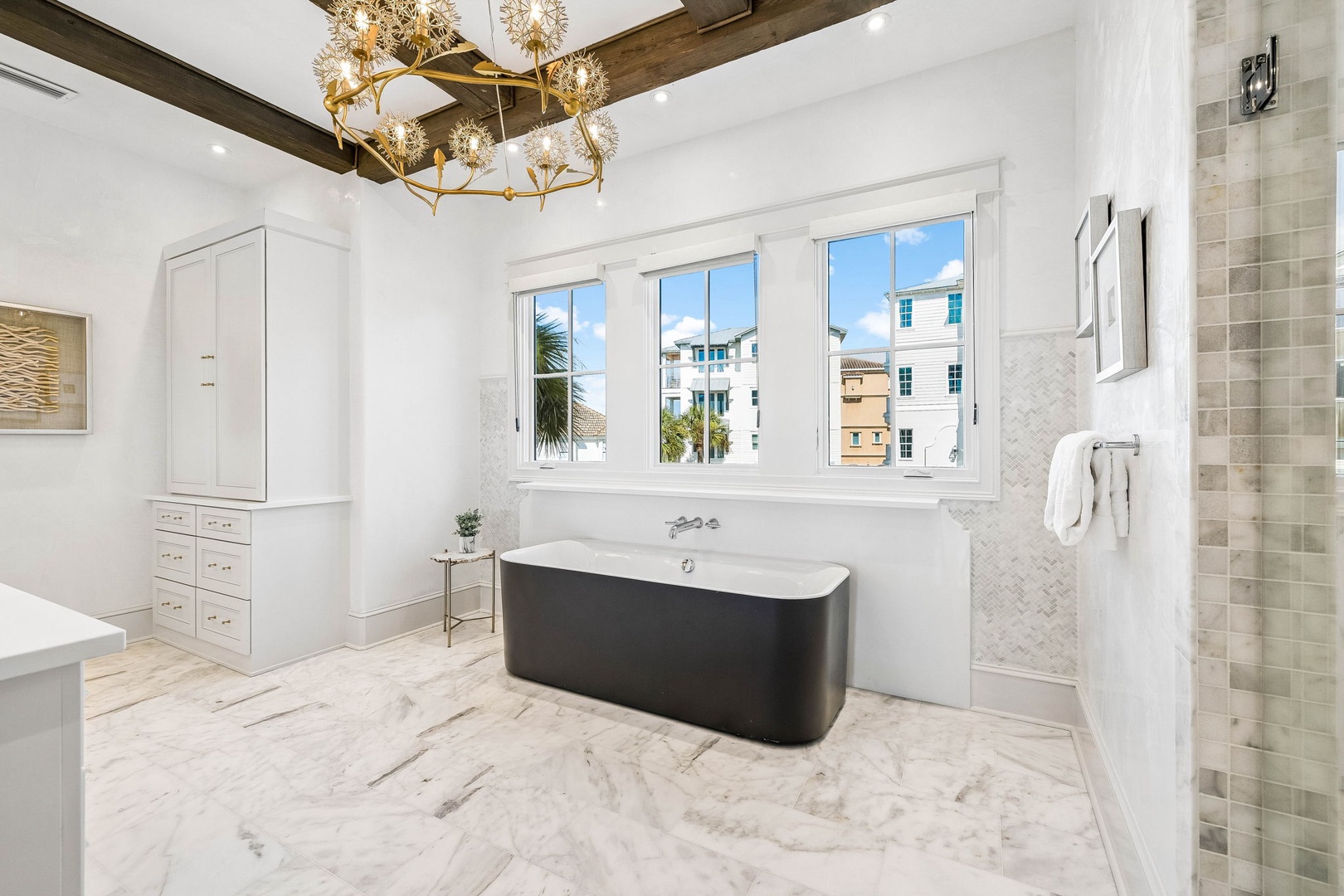 Unwind in your luxurious ensuite with a stunning freestanding tub, gleaming marble floors, and a spacious walk-in shower—all bathed in natural light from oversized windows.