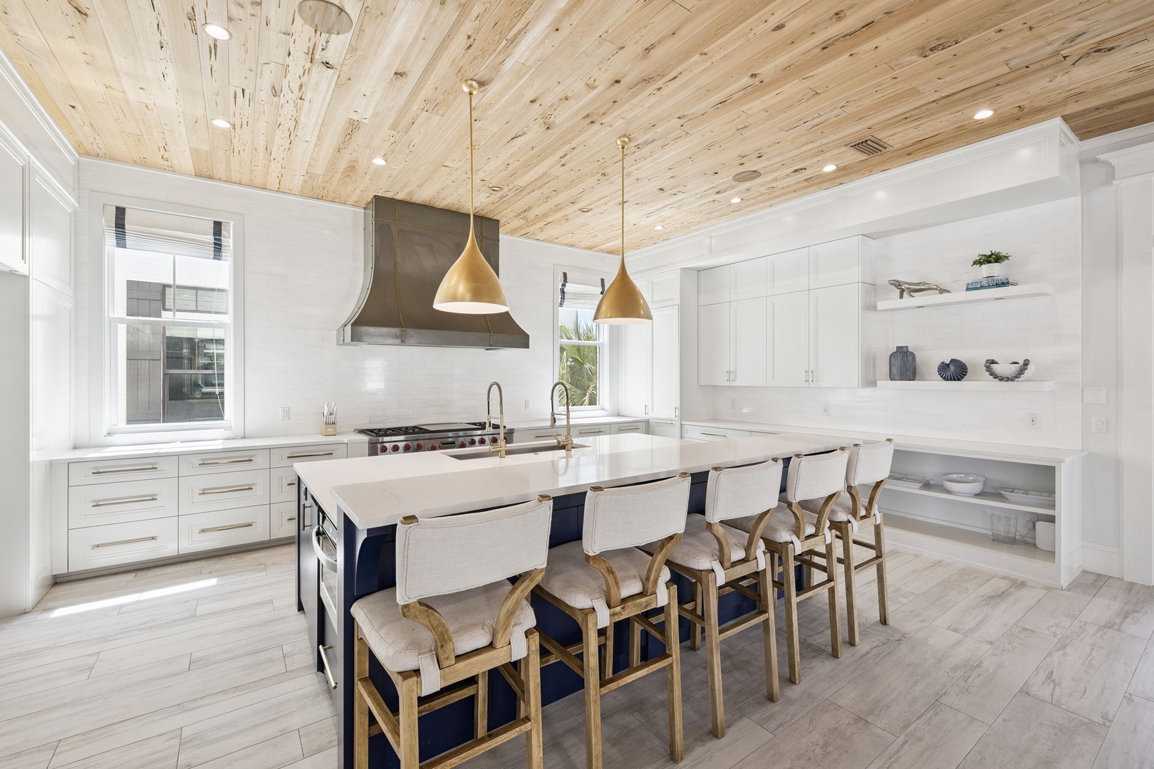 Your dream kitchen awaits with stunning wood ceilings, gleaming counters, and a spacious island perfect for cooking together and creating memories.