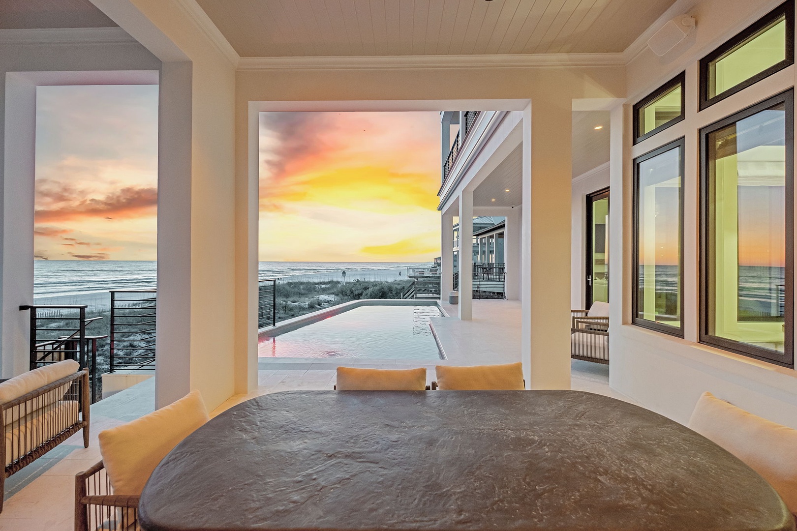 Wake up to stunning ocean views from your luxurious bedroom, where floor-to-ceiling windows frame breathtaking sunrises over endless blue waters.