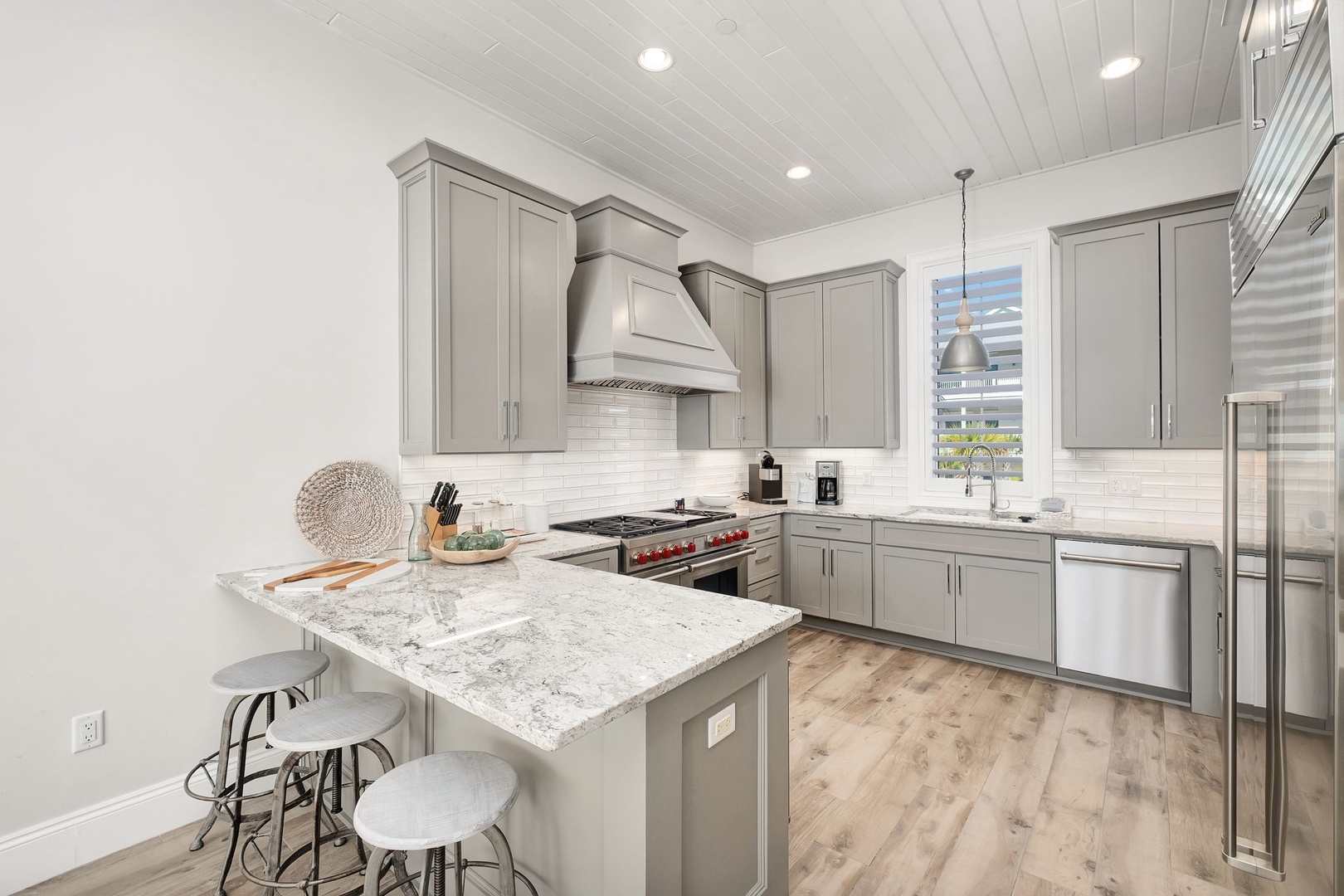 Your gourmet kitchen awaits with granite countertops, stainless appliances, and a breakfast island perfect for morning coffee.