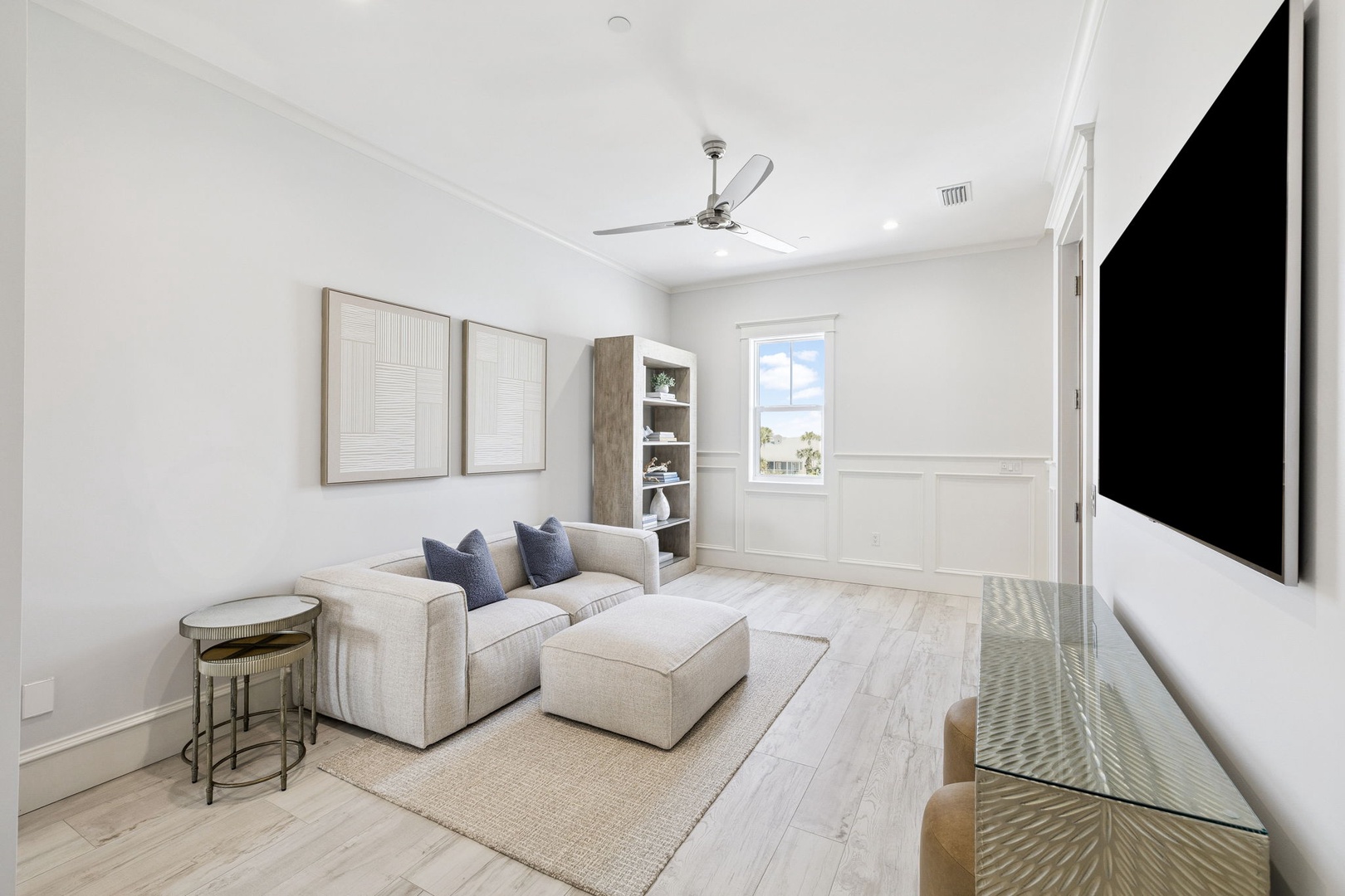 Unwind in your bright, airy living space with comfortable seating, entertainment center, and coastal charm throughout.