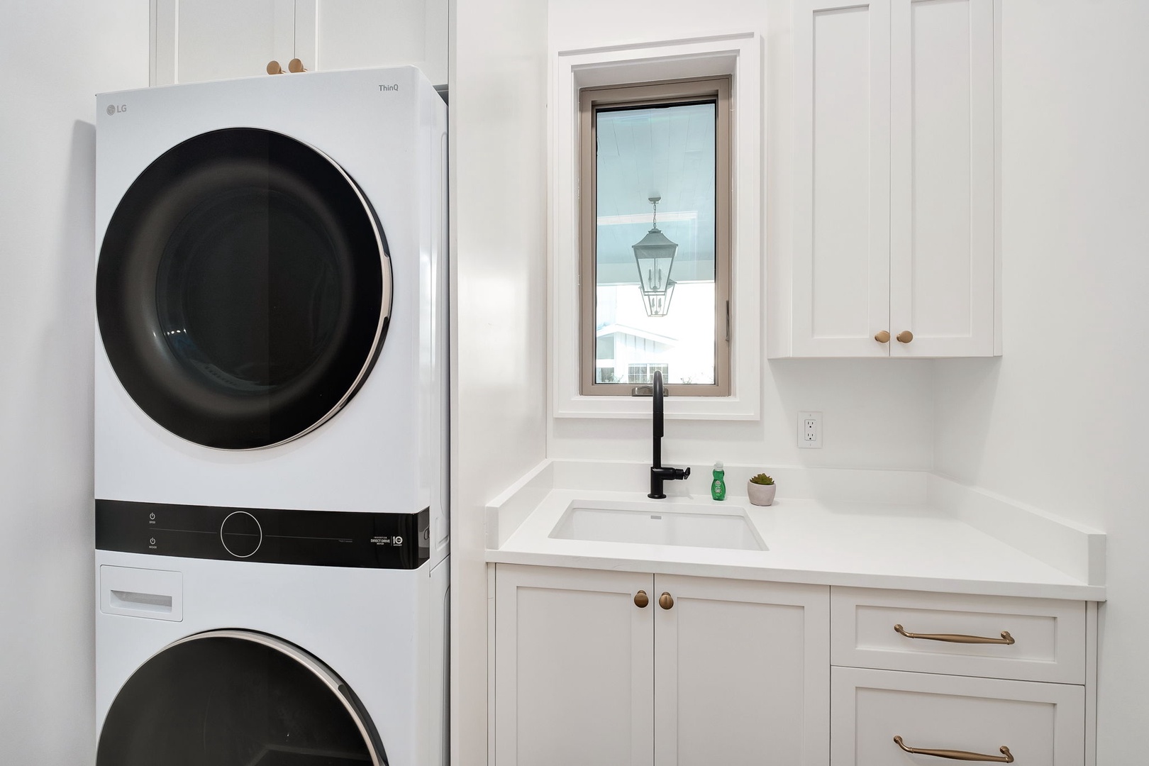 Your laundry stays fresh in this bright, organized space with modern appliances and convenient sink for hand-washing delicates.