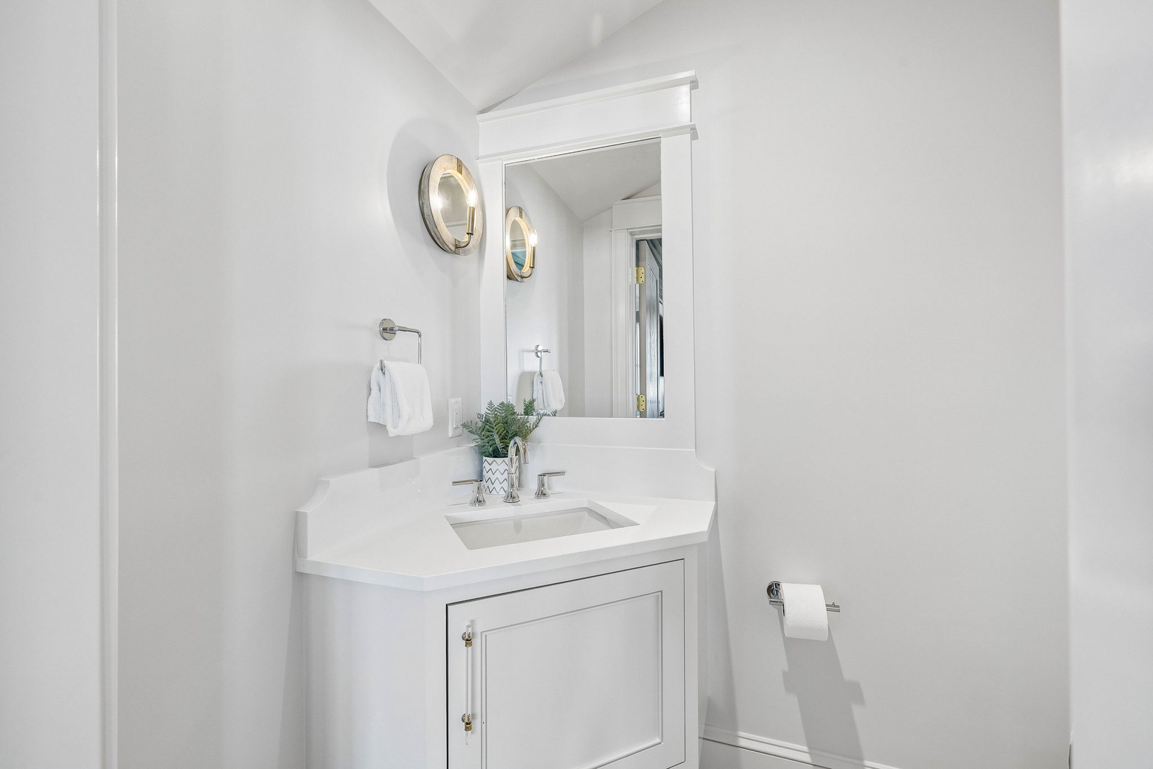 Step into your bright, immaculate bathroom, where crisp white finishes create a serene, spa-like retreat with elegant lighting and thoughtful touches.