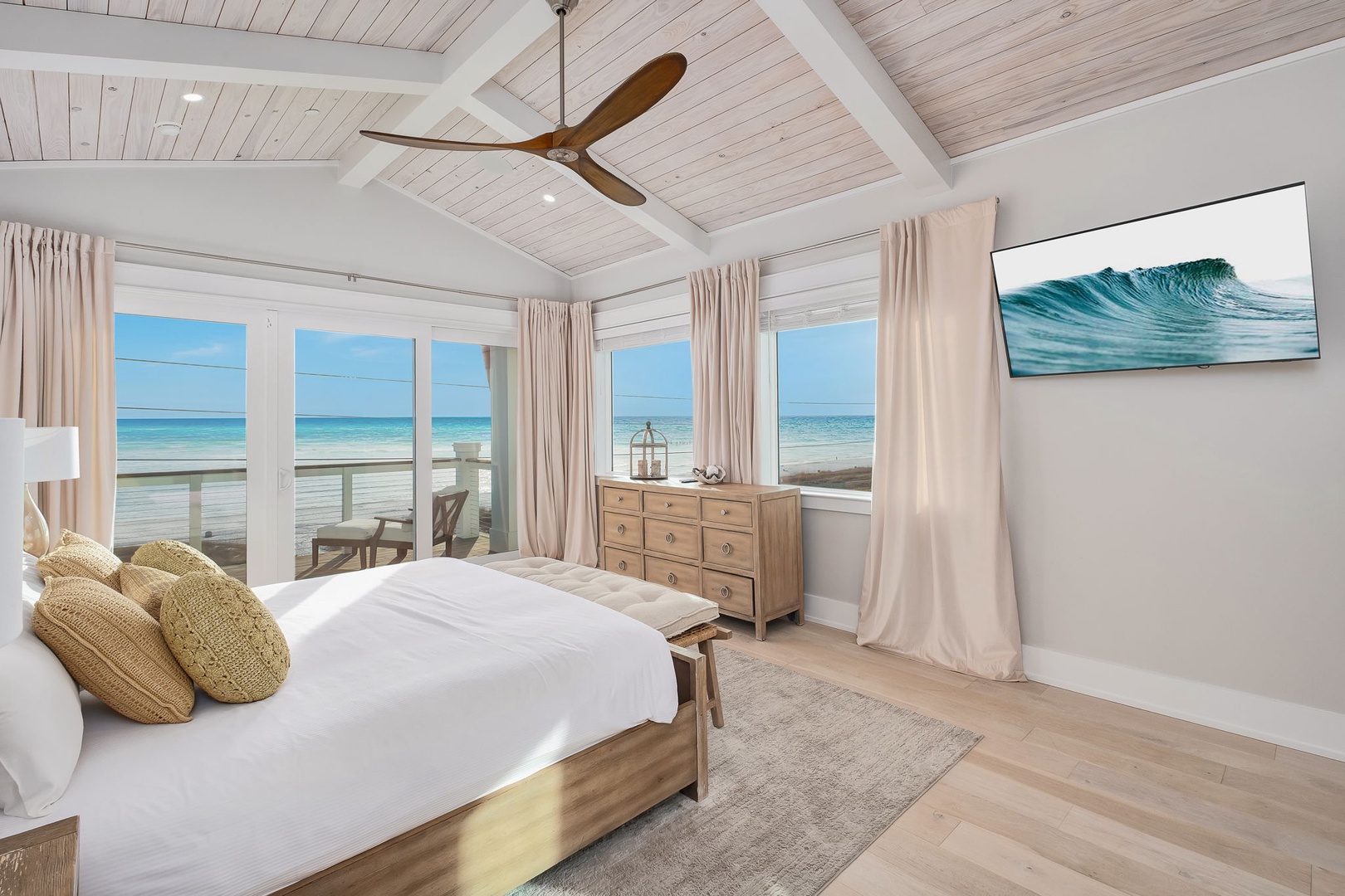 Wake up to endless ocean views from your private bedroom sanctuary, where crisp white linens meet warm coastal breezes.