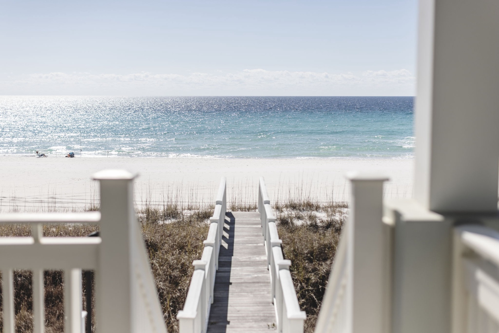 Private boardwalk leads you straight to soft white sand and sparkling turquoise waters, with unobstructed views of the Gulf stretching endlessly before you.
