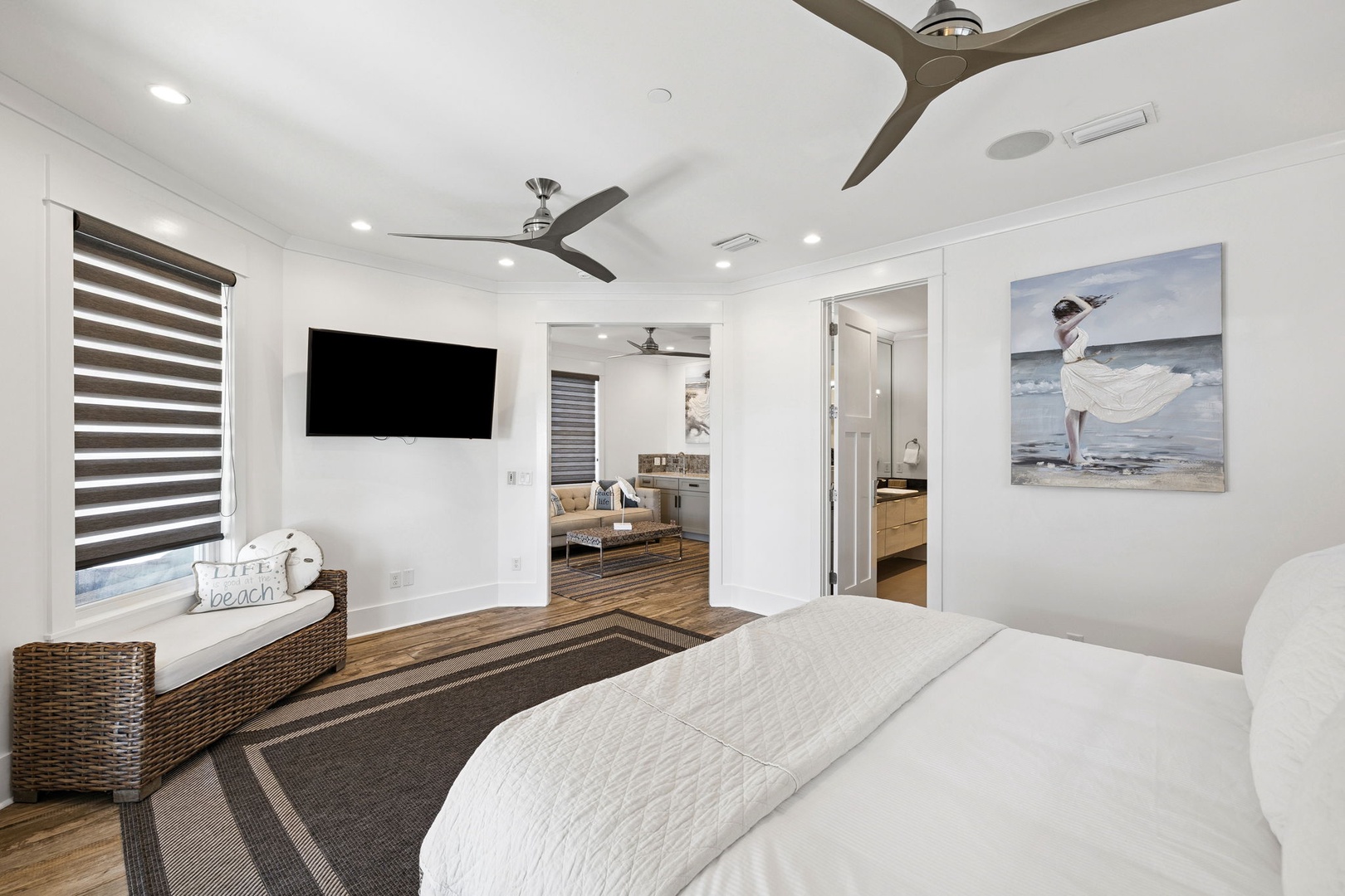 Drift off to sleep in this serene bedroom where coastal art and modern comfort meet your perfect getaway.