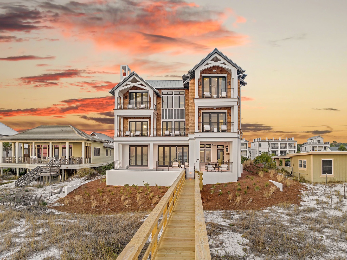 Striking beachfront property with dramatic sunset views creates the perfect coastal retreat backdrop.