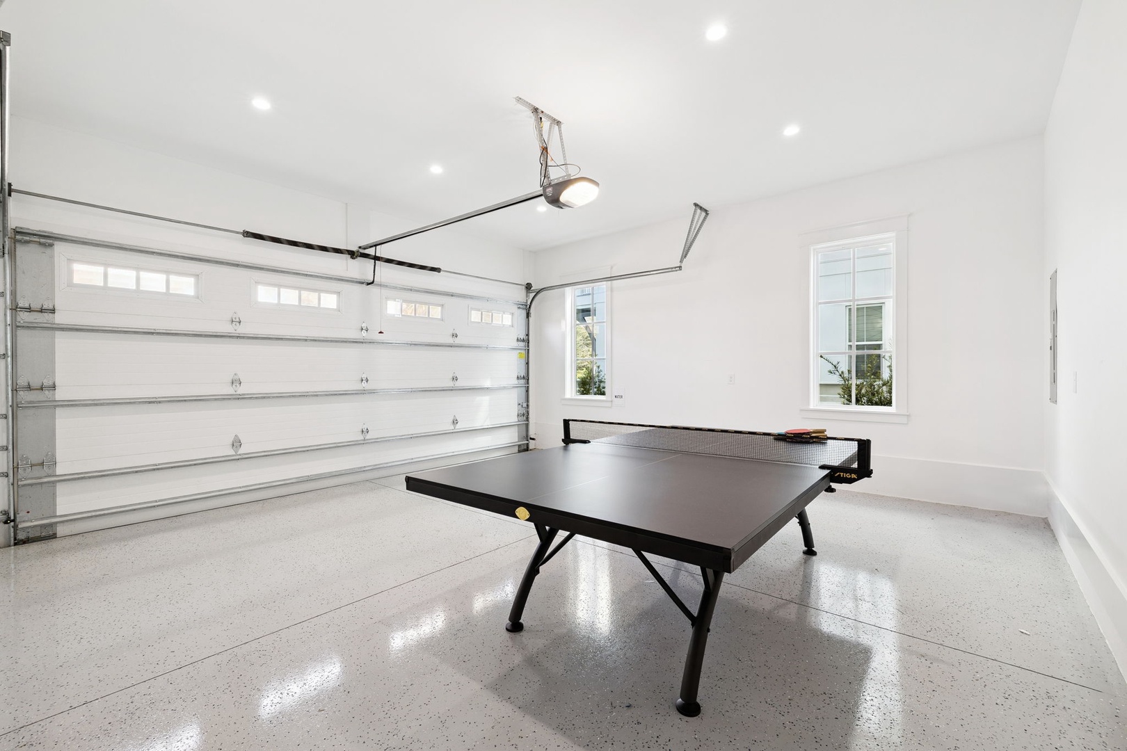 Your private game room awaits with a professional ping pong table in this bright, spacious garage conversion.