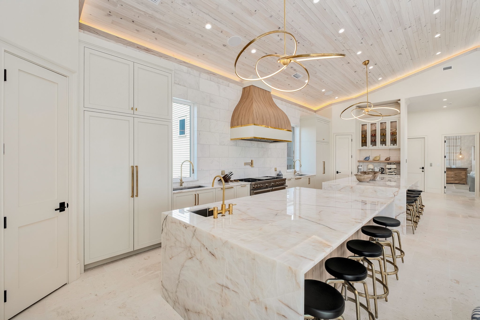 Imagine cooking in this stunning gourmet kitchen, where marble countertops gleam under designer lighting and every detail invites you to gather, create, and savor unforgettable meals.
