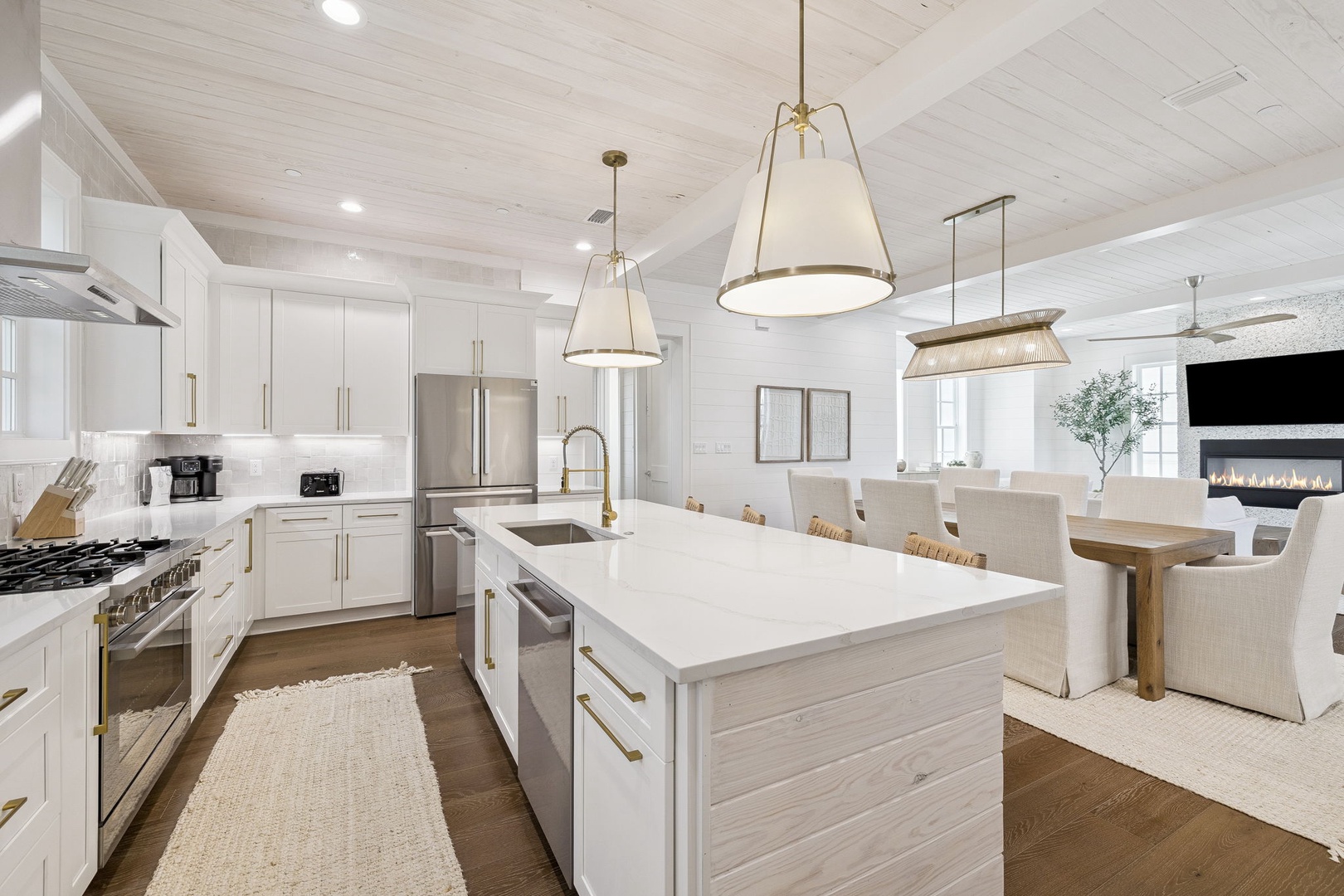 Your spacious kitchen awaits with pristine countertops, modern appliances, and warm lighting perfect for cooking memorable meals together.