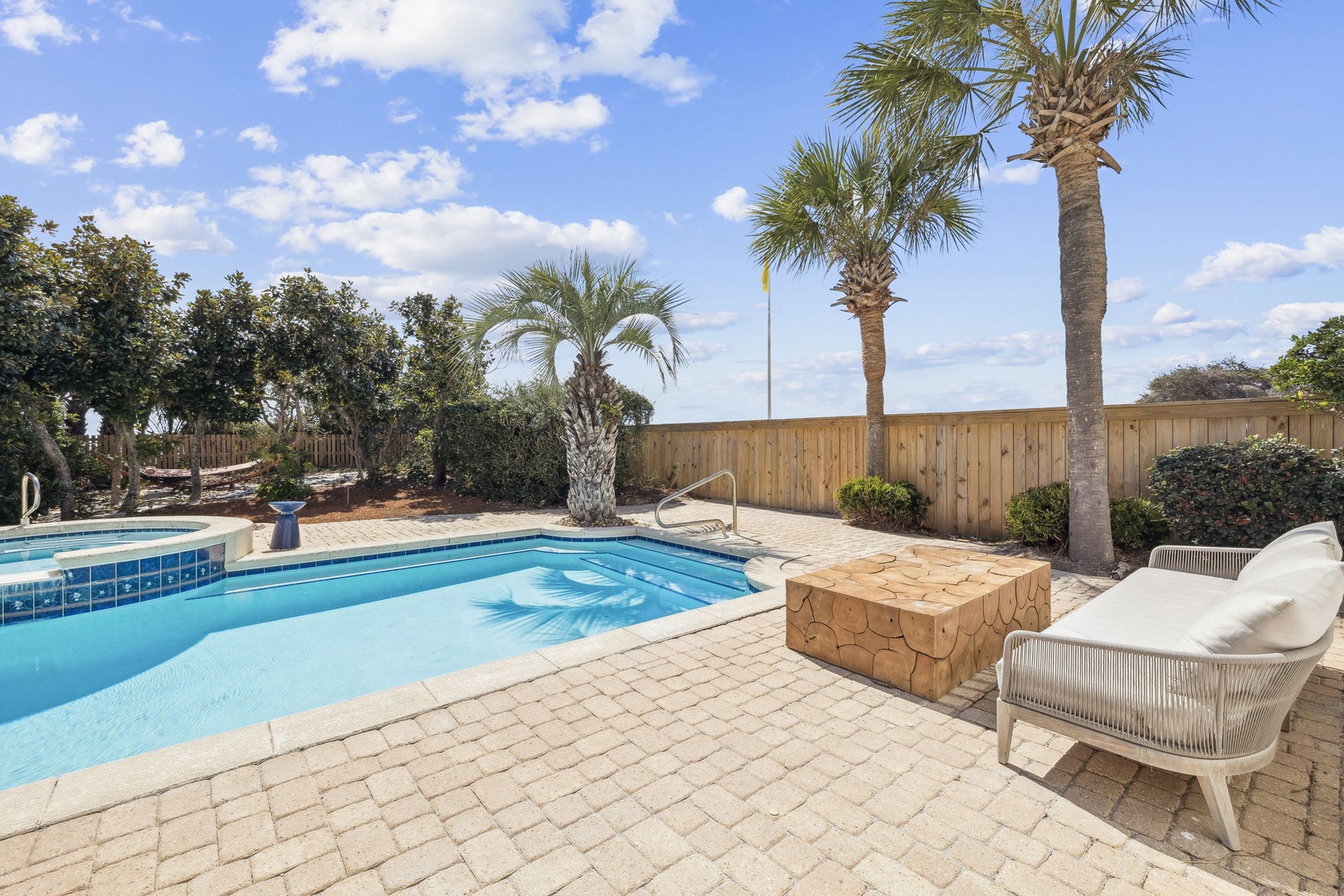 Your private pool paradise awaits with swaying palms and sunshine—perfect for morning swims and afternoon relaxation.