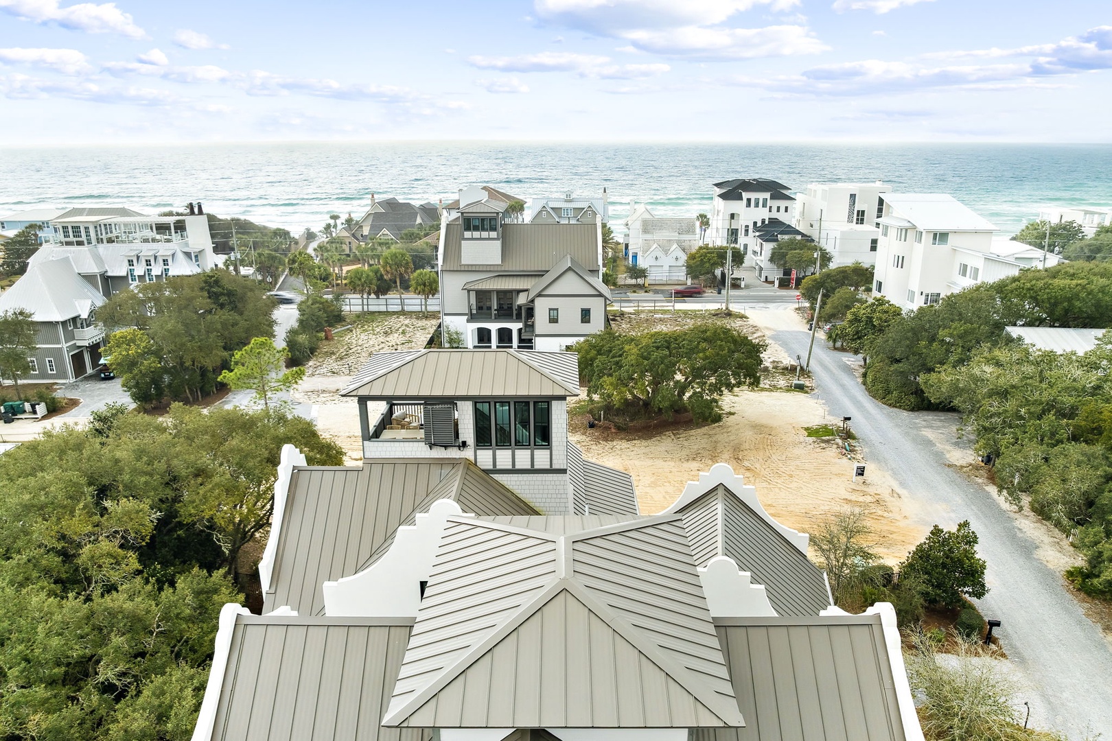 Elevated coastal community featuring modern beach homes just steps from the pristine shoreline and turquoise waters.