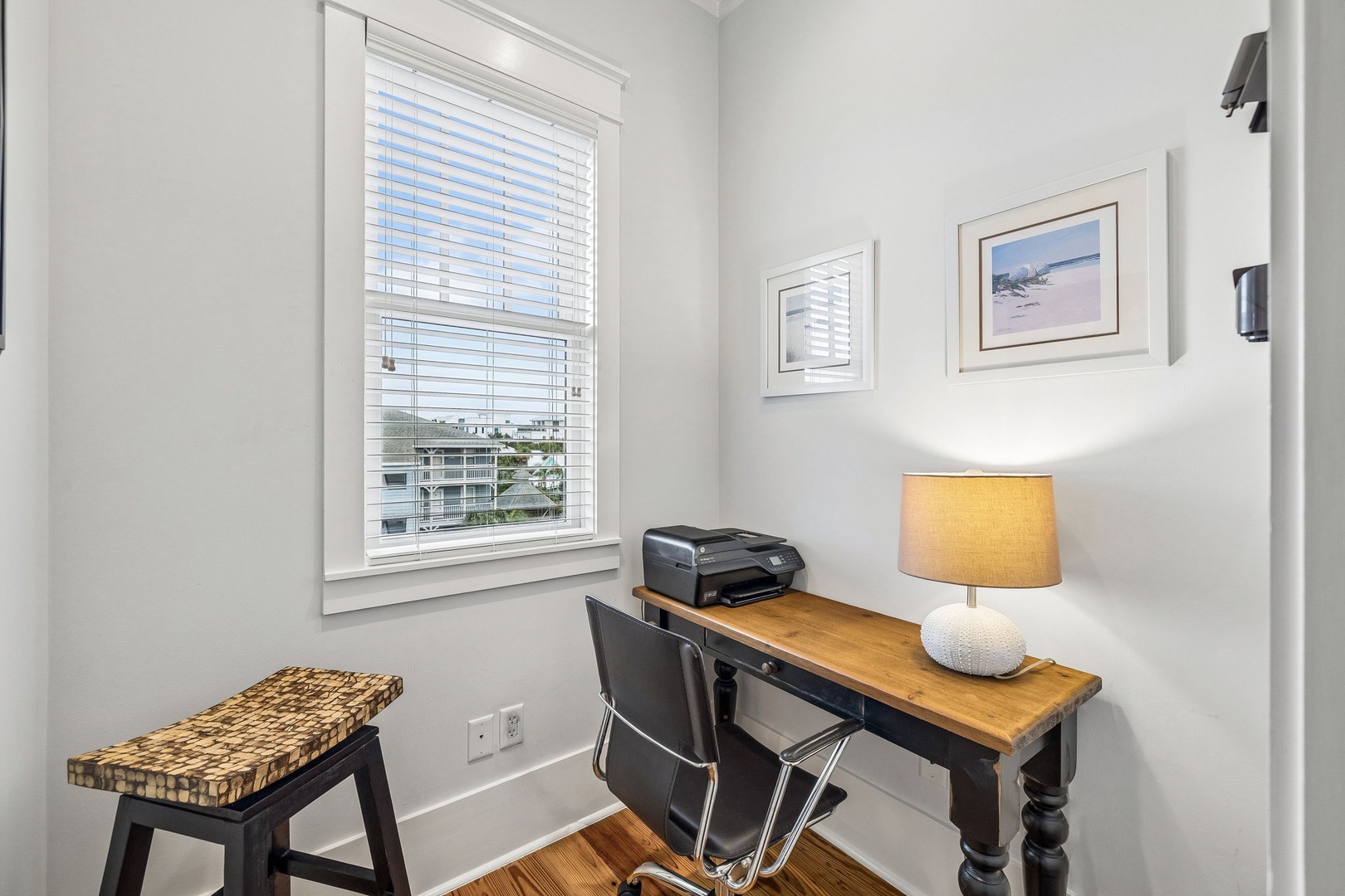 Your dedicated workspace with natural light, a rustic desk, and all the essentials for staying productive during your stay.