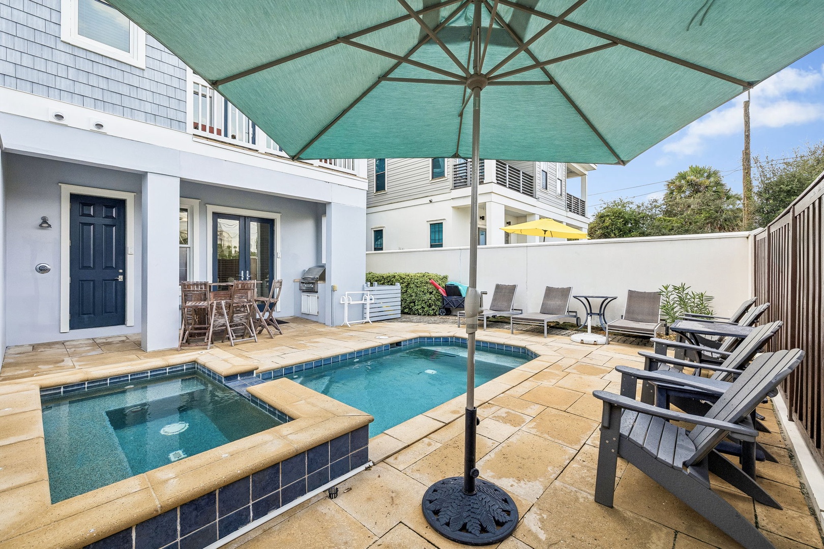 Your private courtyard oasis awaits—lounge poolside under the shade, soak in the spa, or grill dinner al fresco on the patio.