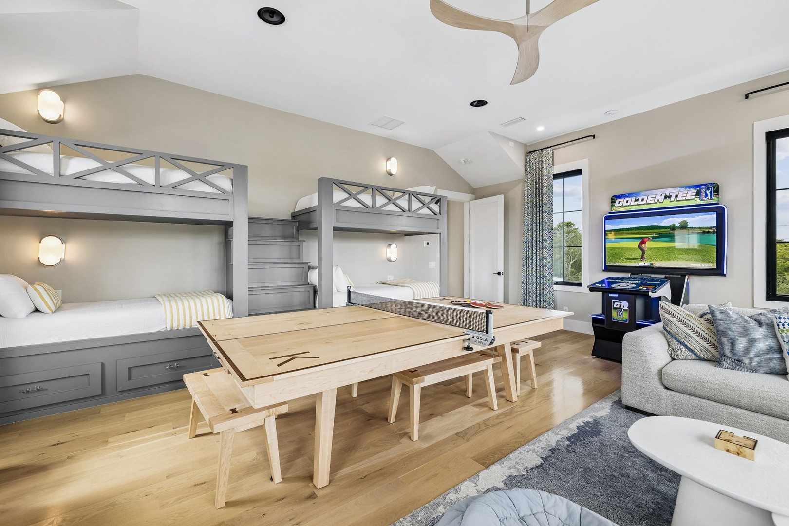 Your family's perfect retreat with custom bunk beds, a game-ready space, and bright windows framing peaceful golf course views—adventure and relaxation in one inviting room.