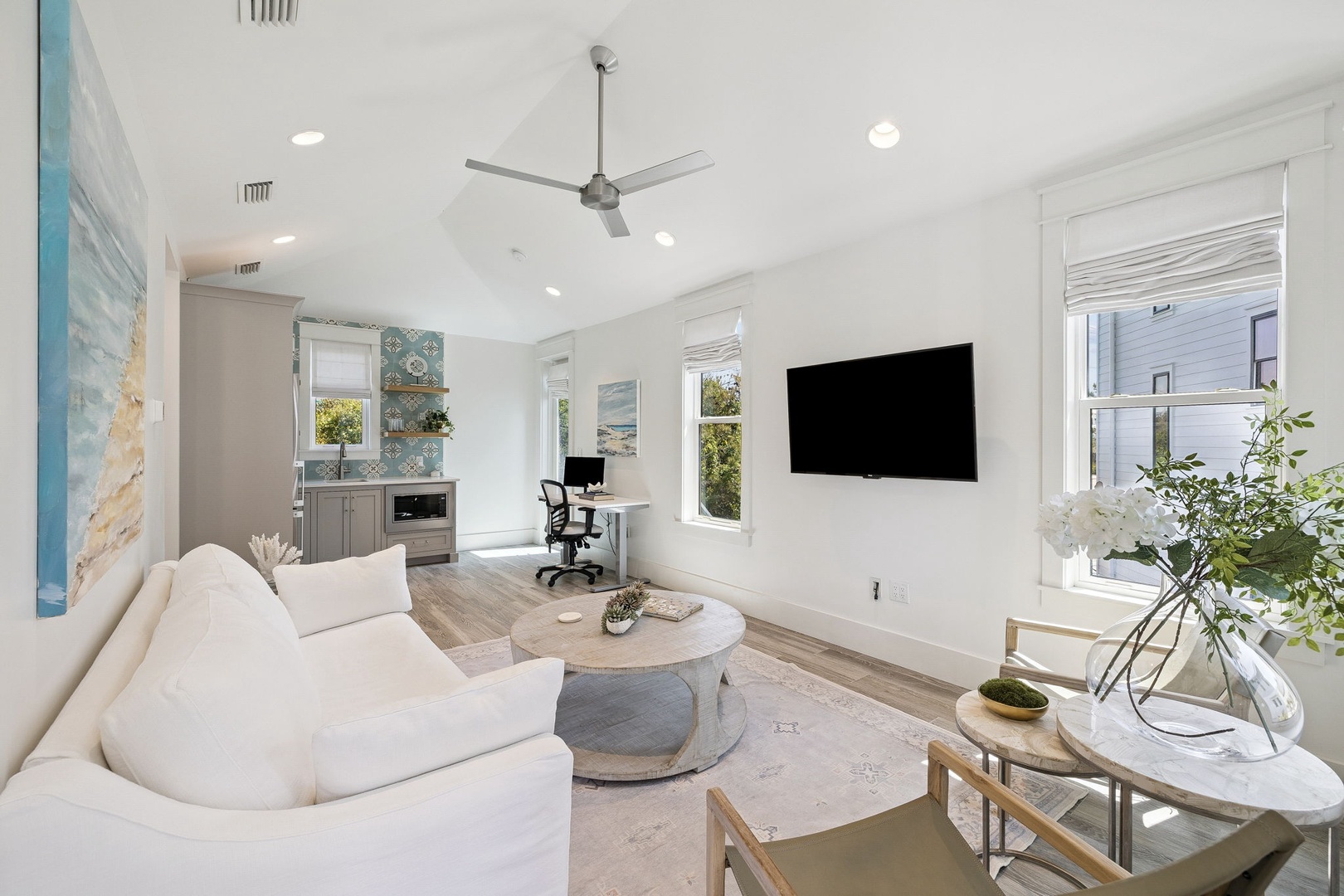 Relax in your bright, modern living space with plush seating, smart TV, and stylish coastal touches throughout.