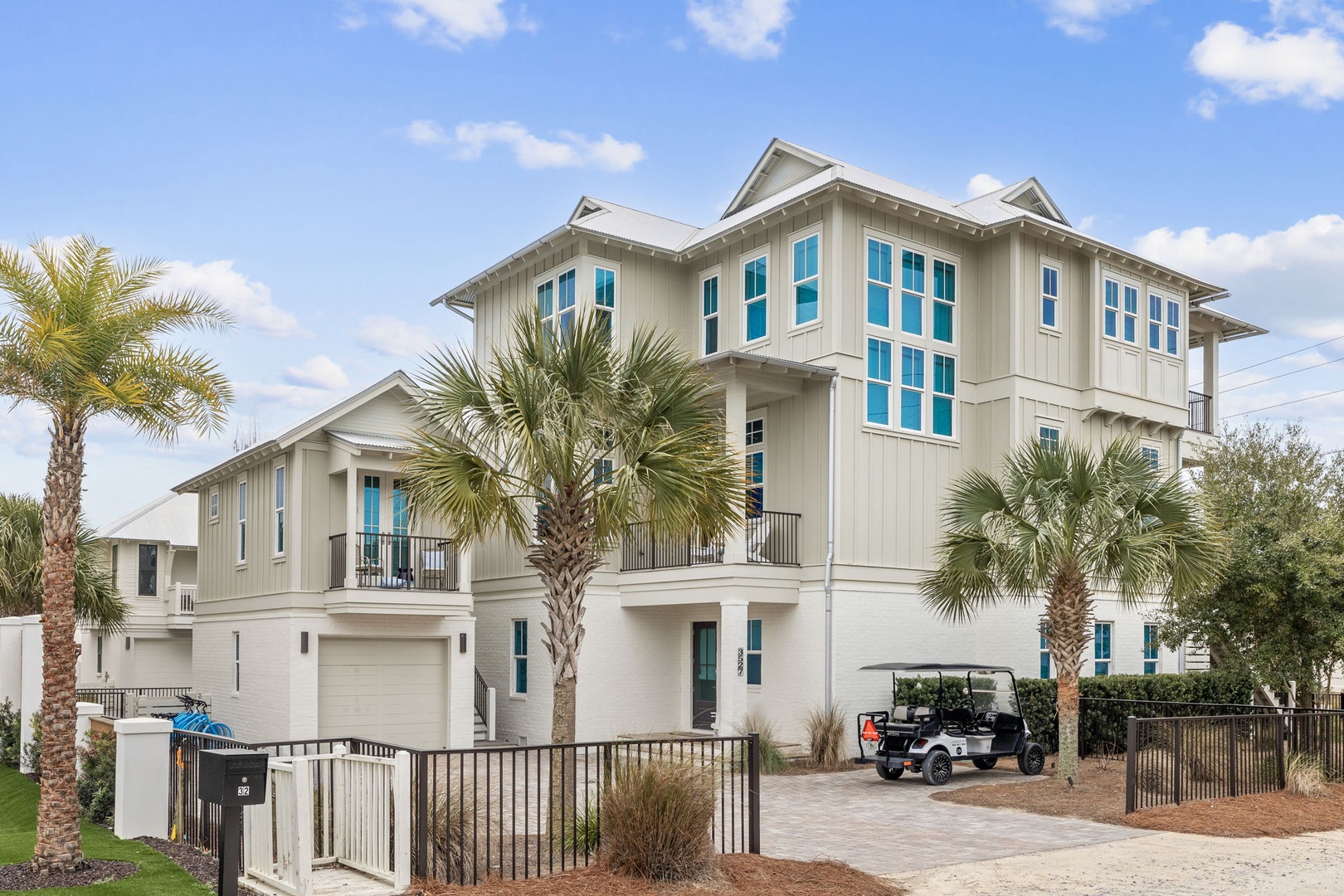 Modern beachside property featuring tropical landscaping and coastal architecture in a prime vacation destination.