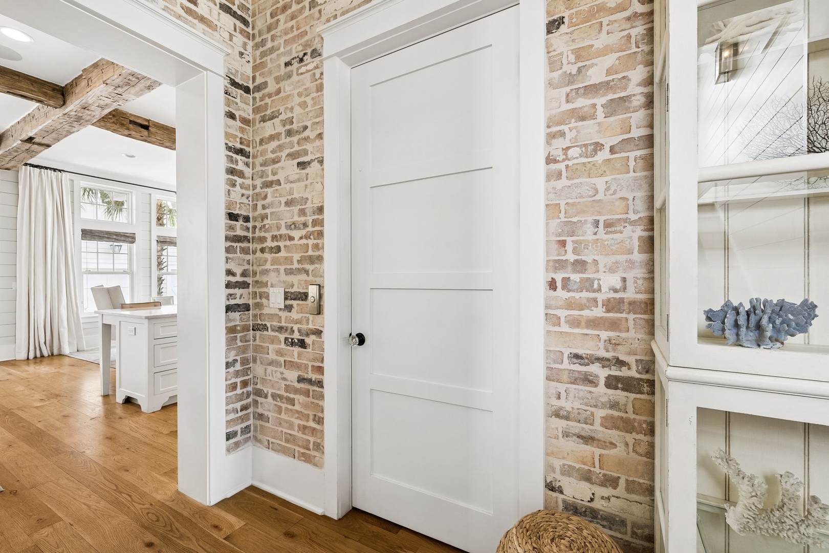 Step into a space where rustic meets refined—exposed brick walls and reclaimed wooden beams frame your charming retreat, blending historic character with modern comfort.