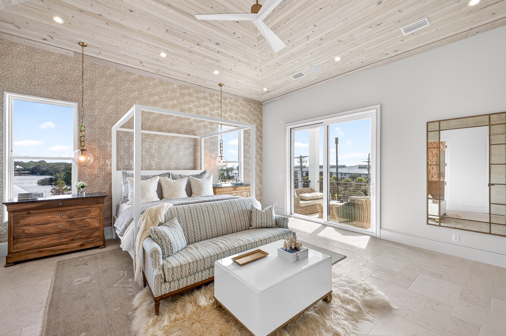 Wake up in your luxurious bedroom suite with stunning natural light, elegant four-poster bed, and private balcony access for morning coffee.