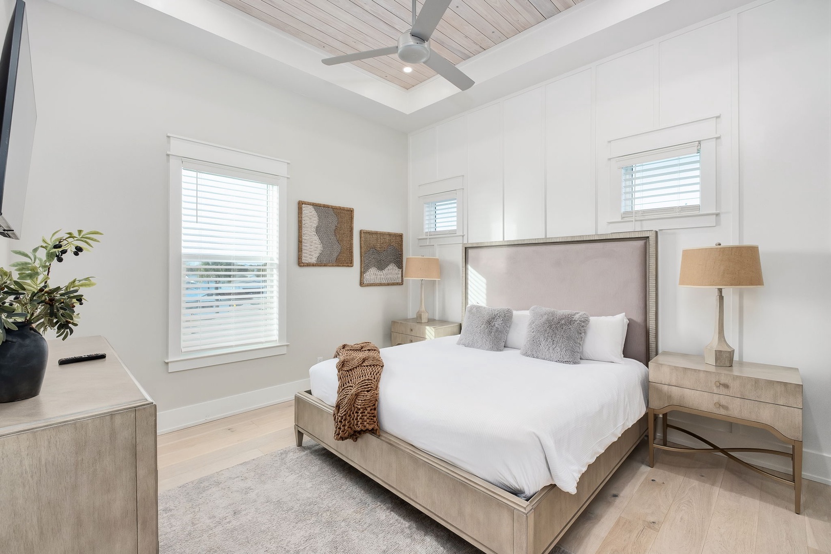Drift off in this serene bedroom with soaring ceilings and natural textures that create your perfect peaceful retreat.