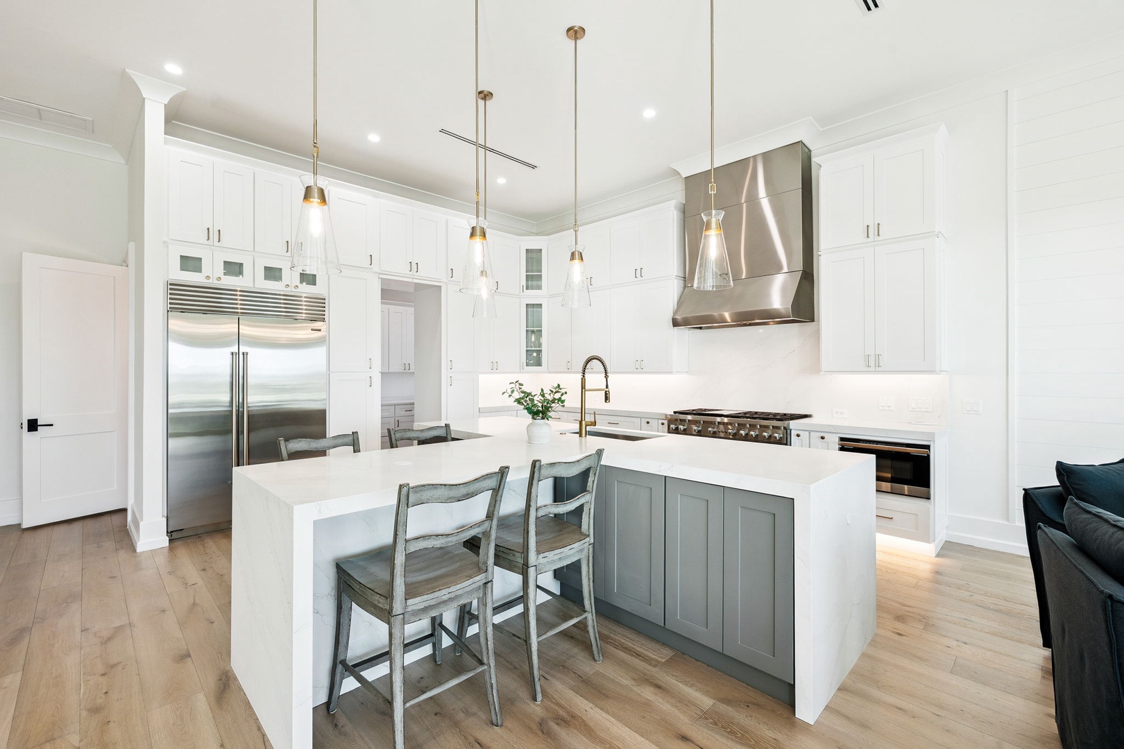 Your gourmet kitchen awaits with premium appliances, marble countertops, and elegant pendant lighting for memorable cooking experiences.