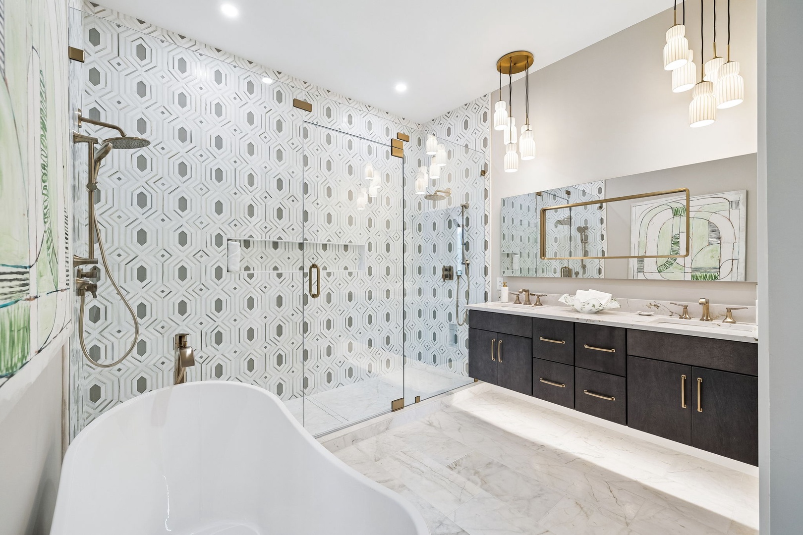 Luxurious spa-like bathroom featuring elegant geometric tile, a soaking tub, dual vanity with modern fixtures, and walk-in shower—your perfect retreat after exploring.