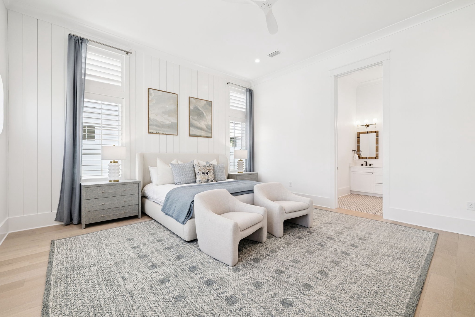 Sink into your peaceful master suite, where soft linens and coastal hues create a serene retreat for restful nights.
