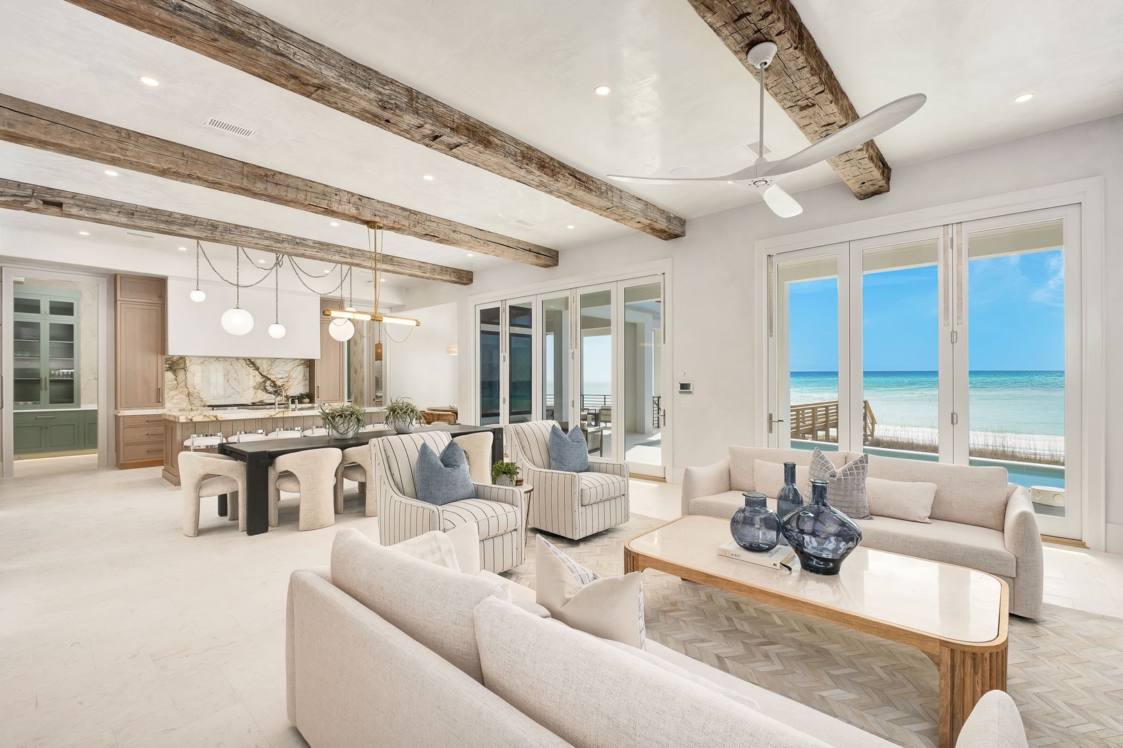 Relax in your open-concept living space where rustic beams meet modern comfort, with stunning ocean views just steps away.