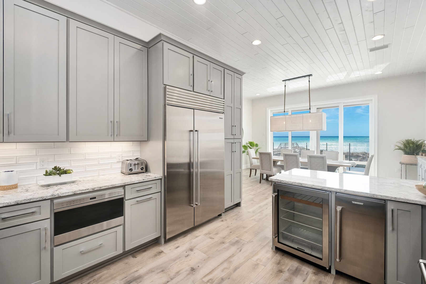 Your gourmet kitchen awaits with marble countertops, stainless steel appliances, and stunning ocean views that make cooking a joy.