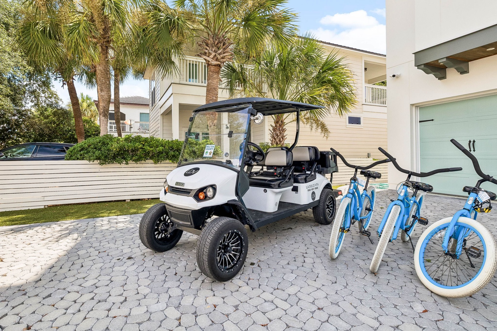 Your stay includes a golf cart and bikes to explore the area effortlessly, with palm-lined streets and coastal charm just steps away.