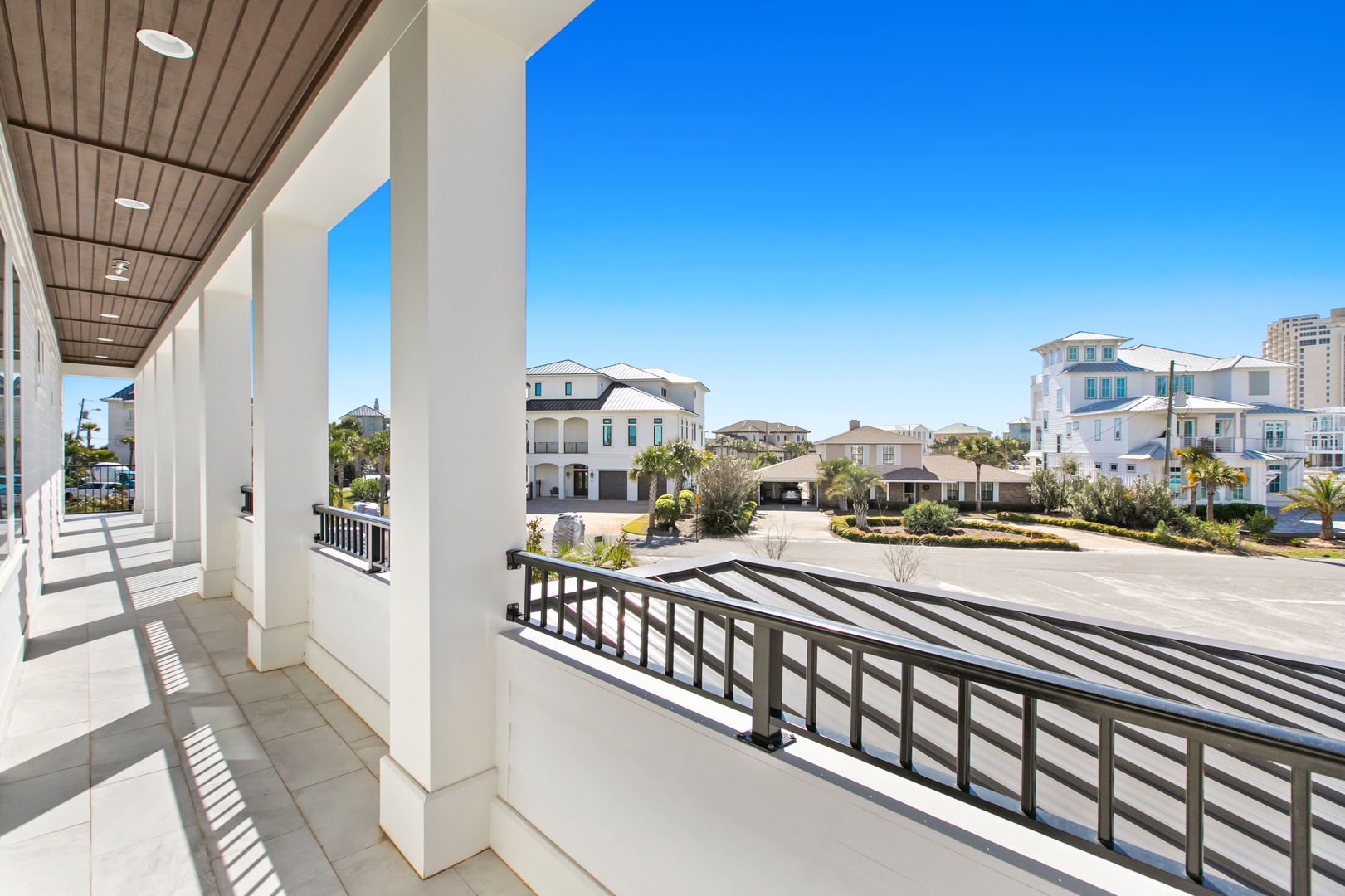 The property sits in a peaceful coastal neighborhood featuring charming architectural details and nearby beach access, just moments from the shore.