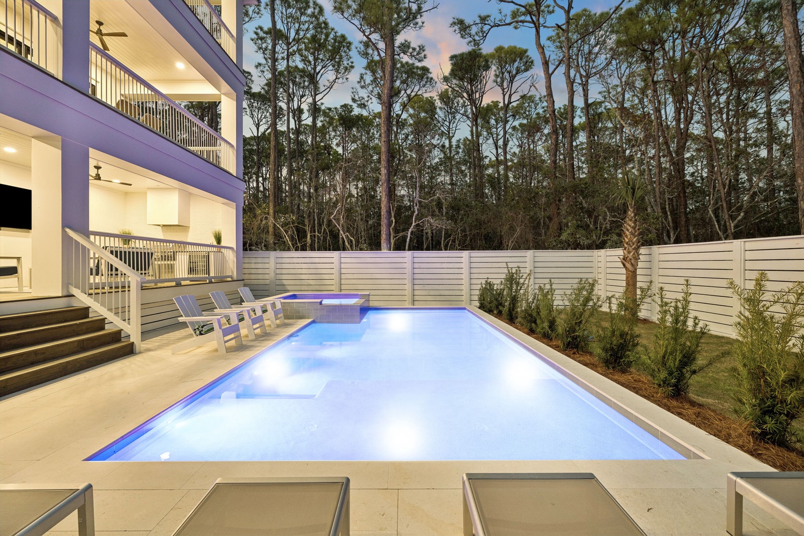 Unwind in your private illuminated pool surrounded by peaceful forest views and modern comfort.