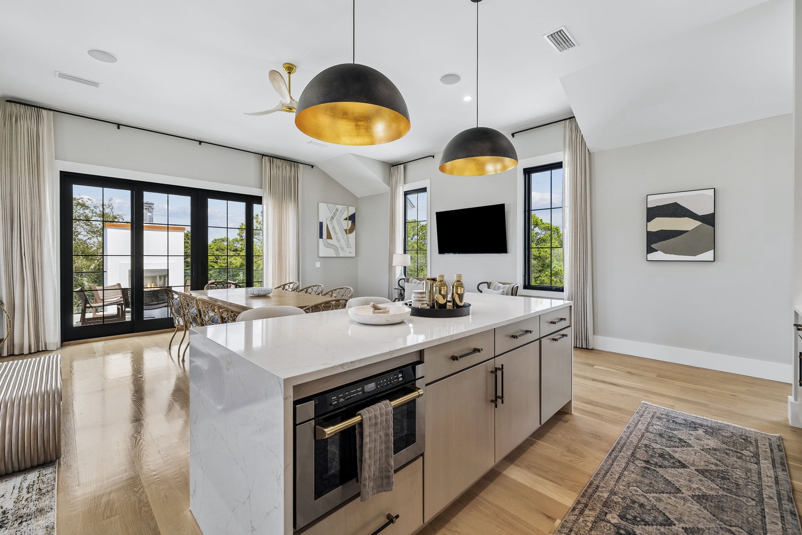 Cook, gather, and unwind in your stylish open-plan living space where gleaming finishes and abundant natural light create a welcoming retreat for your getaway.