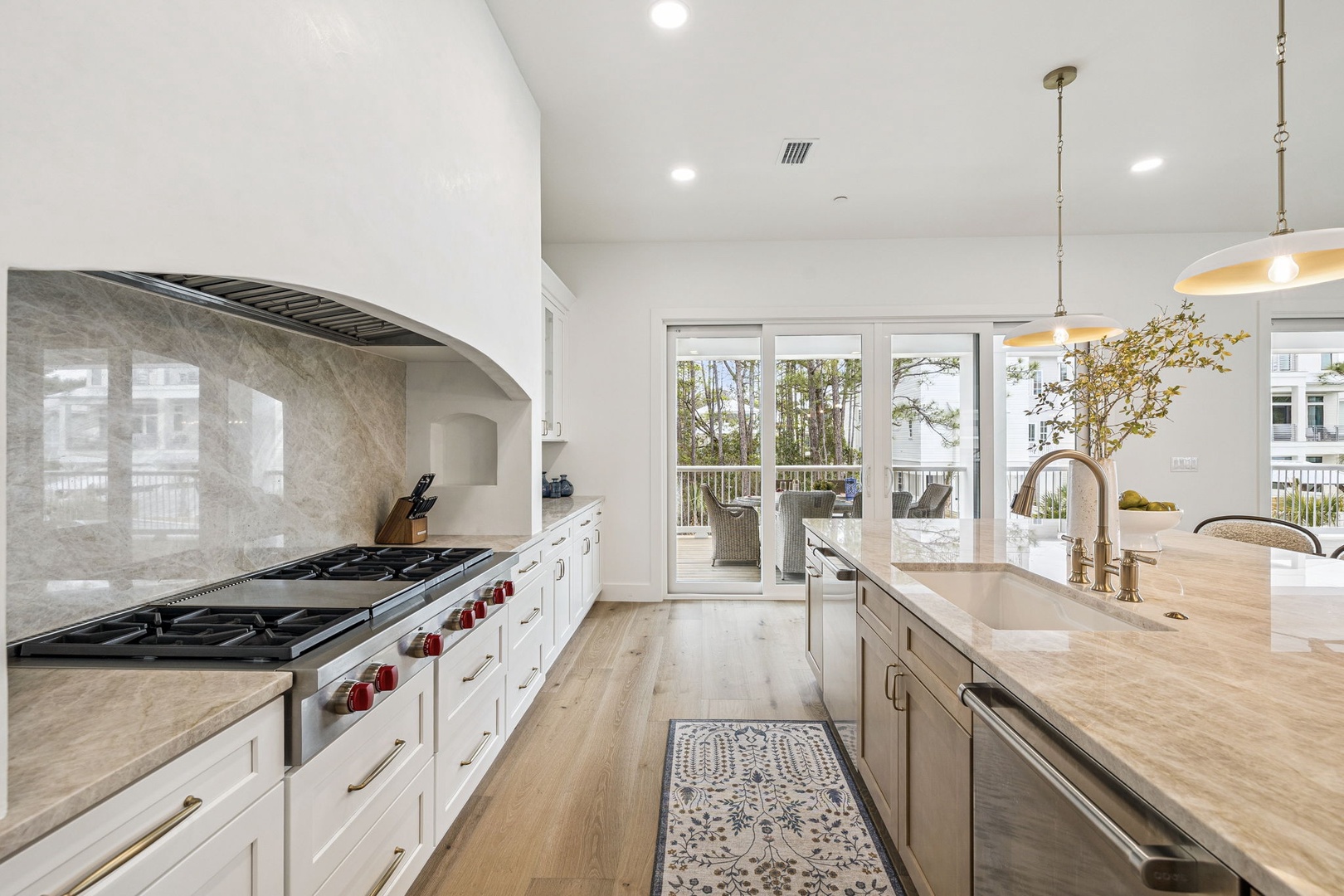 Your gourmet kitchen awaits with marble countertops, professional gas range, and serene balcony views for morning coffee moments.