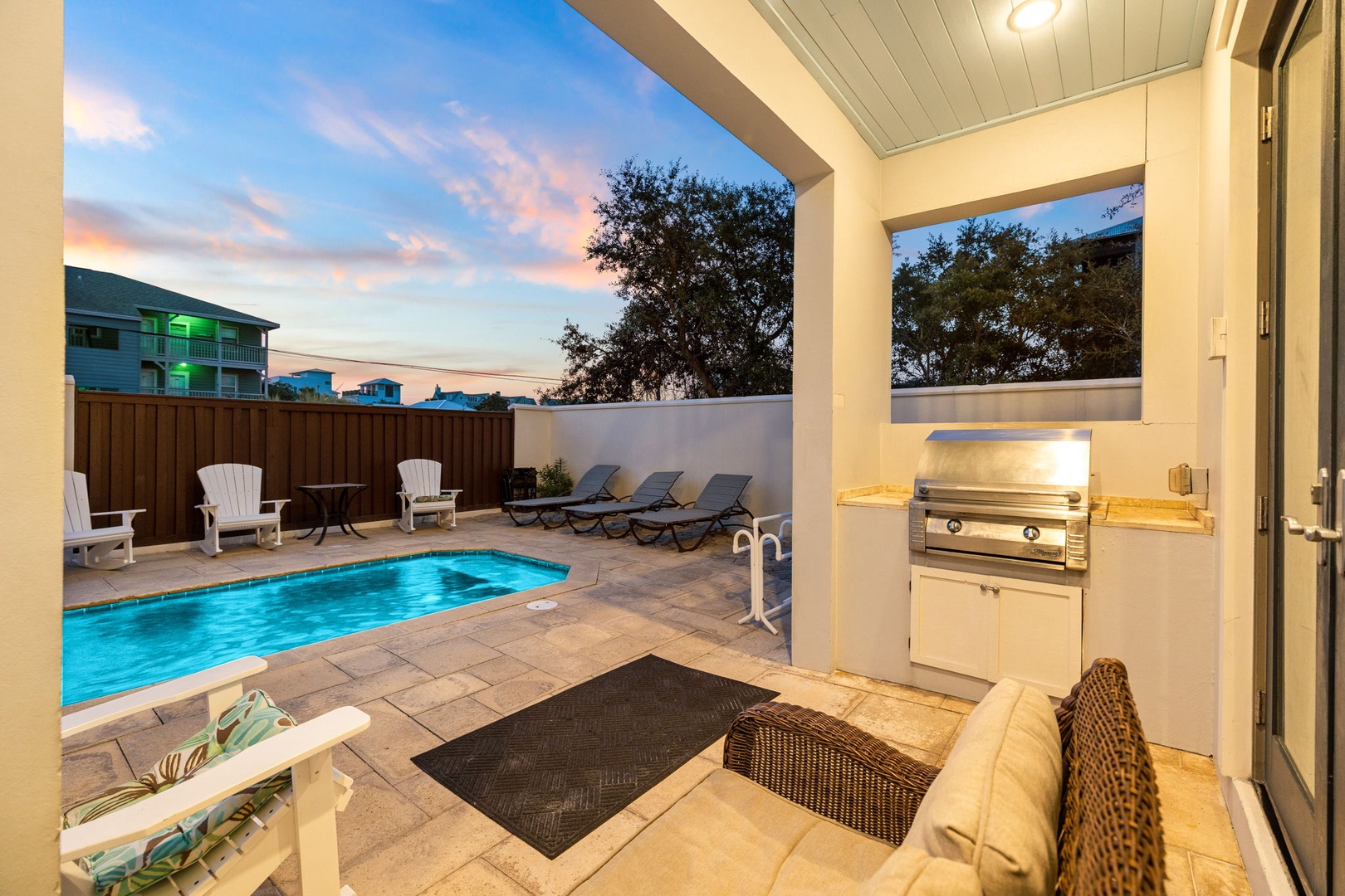 Step into your private outdoor retreat and unwind by the shimmering pool as the sun sets. Fire up the built-in grill for an evening cookout or lounge poolside with a refreshing drink—your perfect coastal getaway awaits.