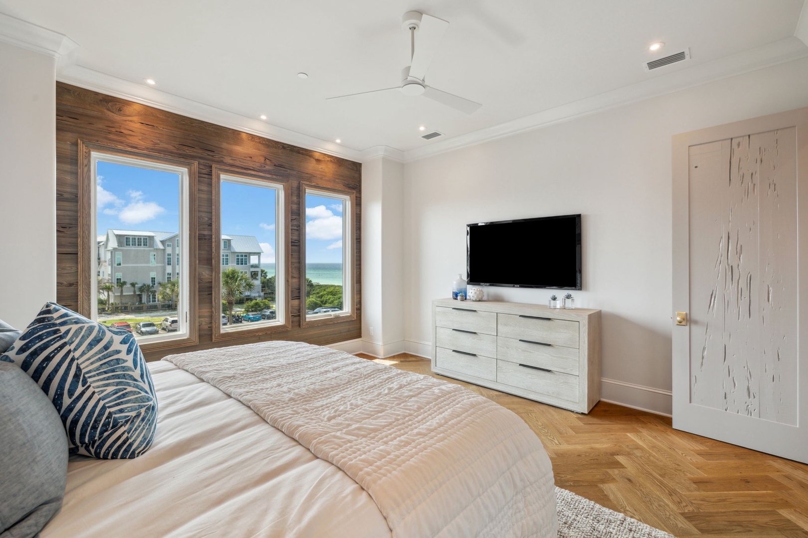 Wake up to stunning ocean views from your bed. Coastal breezes, soft linens, and serene blues create your perfect beachside retreat with modern comfort.