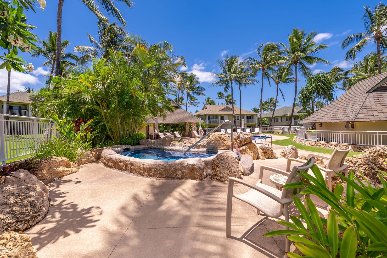 Kapolei Vacation Rentals, Kai Lani Luxury 6D - Relaxing pool area surrounded by lush tropical landscaping, creating an oasis of calm and privacy.