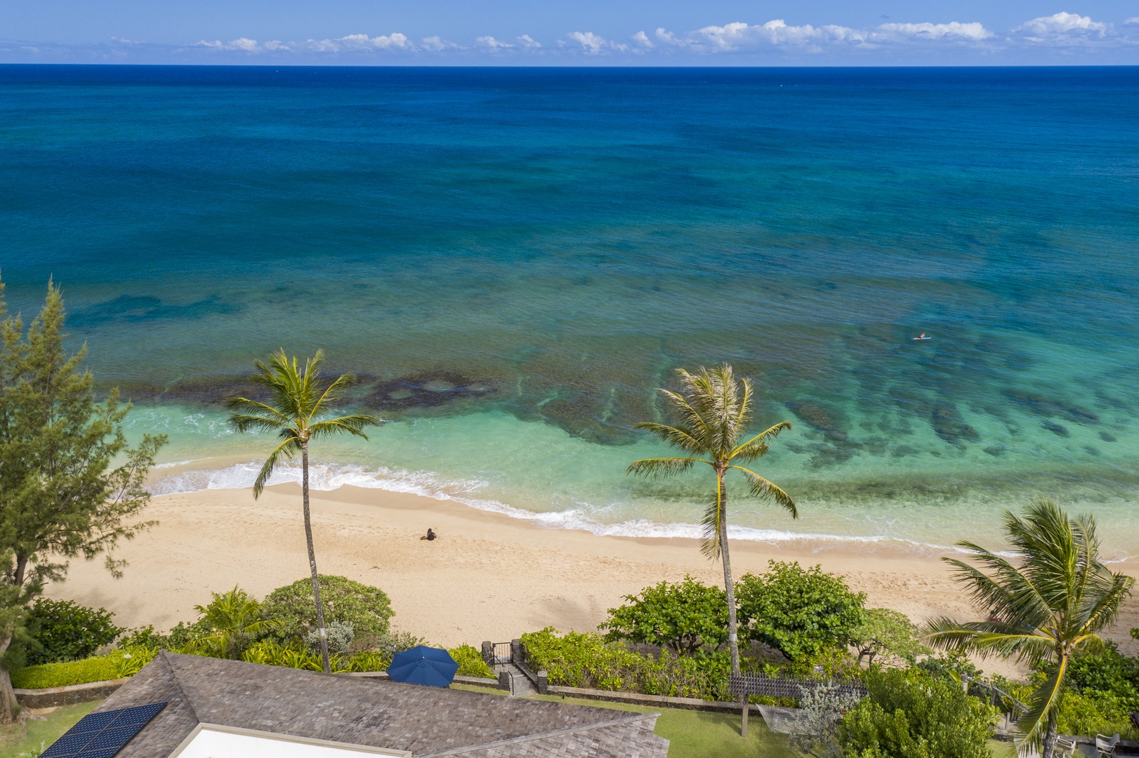 Haleiwa Vacation Rentals, Hale Kimo - Steps to the beach from your private backyard.