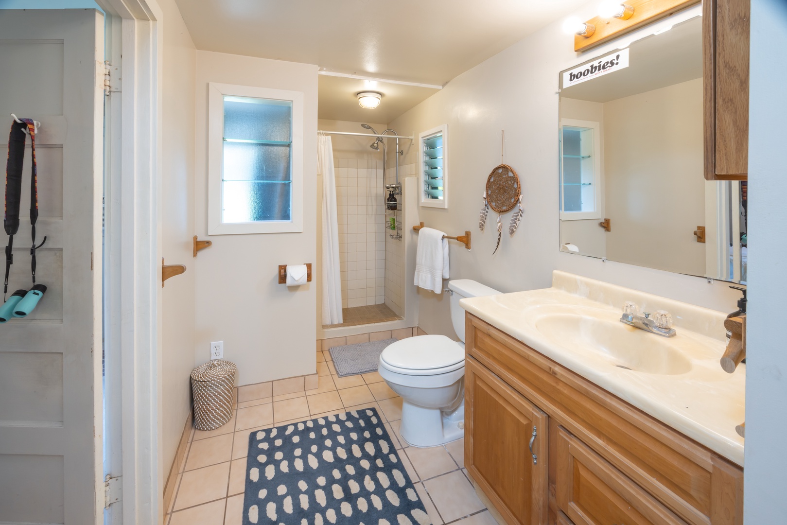 Kahuku Vacation Rentals, Hale Pellicano - The shared bathroom has a single vanity and separate walk-in shower.