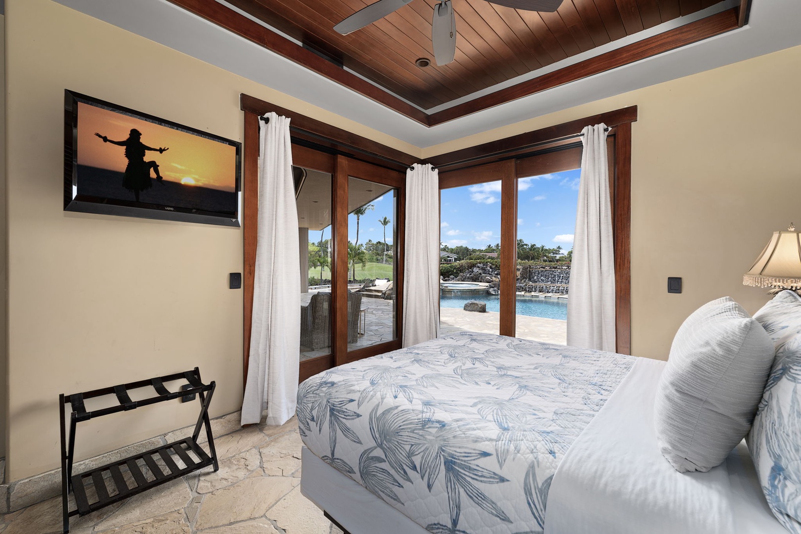 Kamuela Vacation Rentals, Hale Konane - Elegant suite with a plush queen bed, tropical views, and direct access to a private patio for peaceful morning moments.