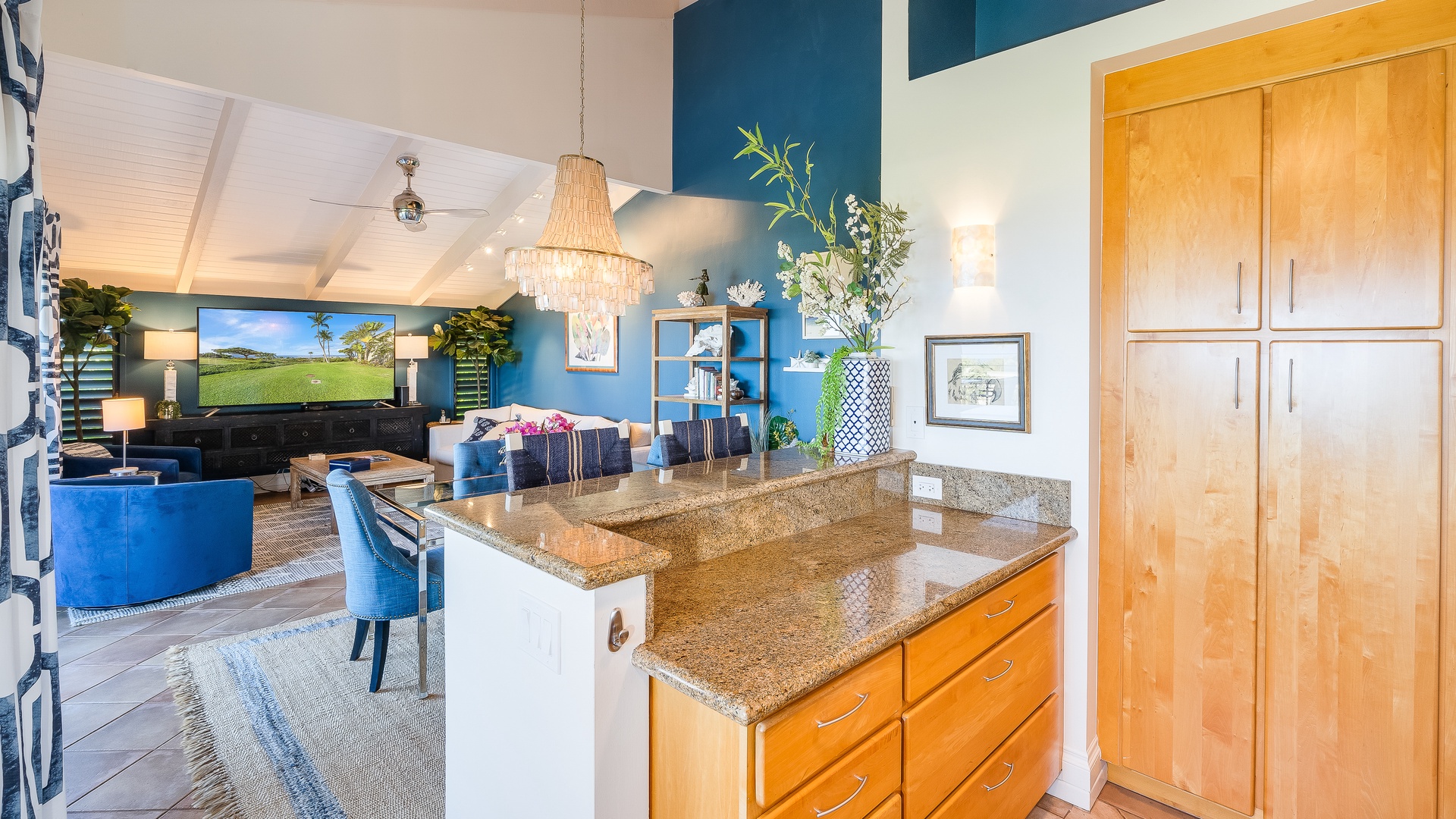 Kihei Vacation Rentals, Wailea Ekolu 1106 - A kitchen island with extra counter space, flowing into a cozy living area.