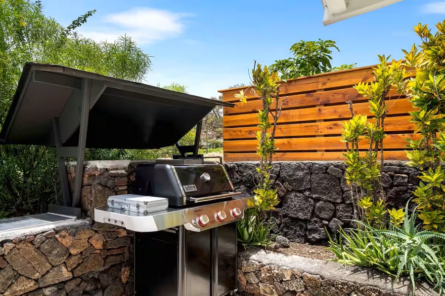 Kailua Kona Vacation Rentals, Manukai Hale - The BBQ station waits behind the privacy fence for grilled meals outside.